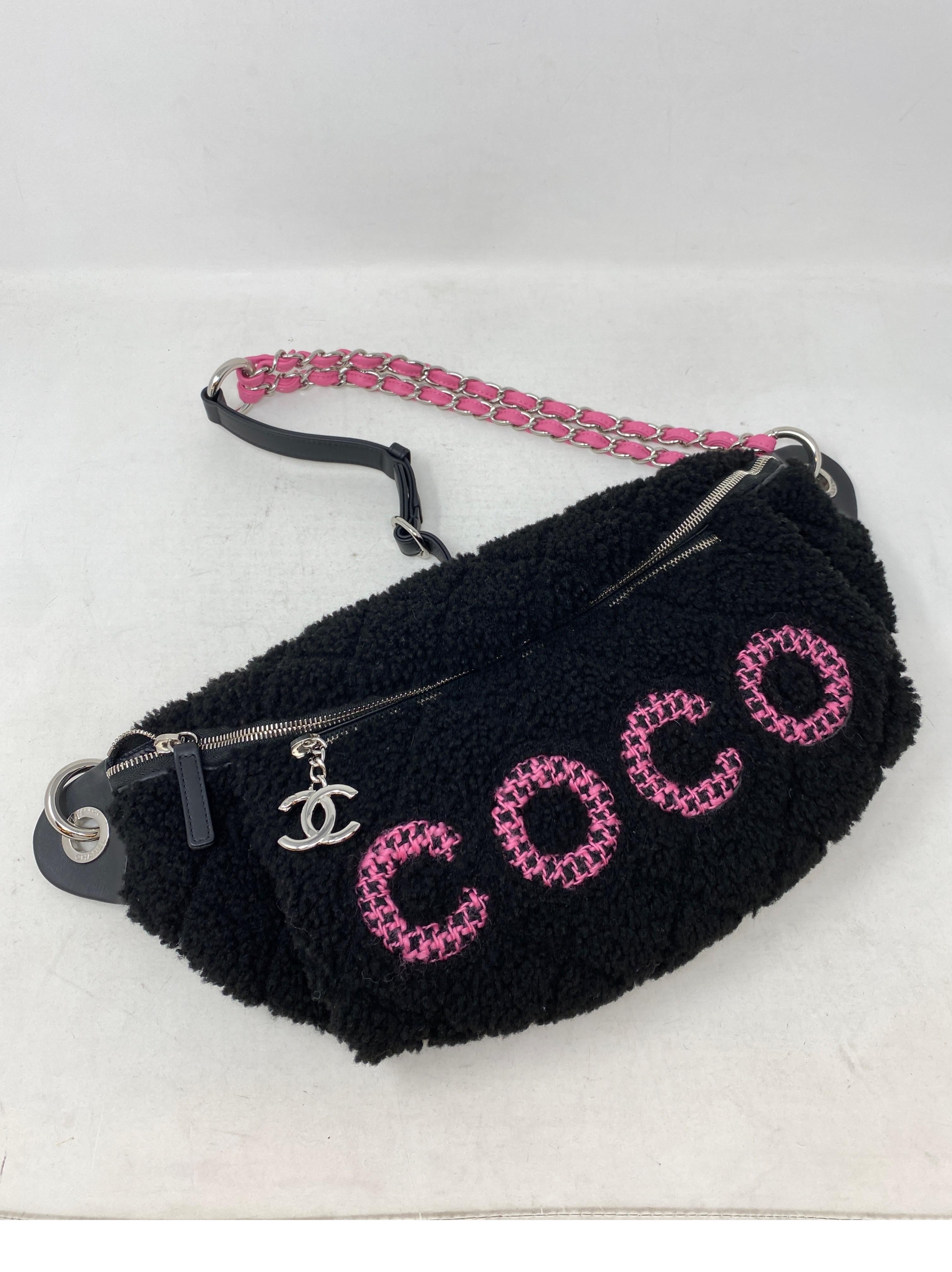 Chanel Coco Black Shearling Bum Bag. Mint like new condition. Rare collector's piece. Hot pink Coco lettering shearling fur waist bag or cross shoulder bag. Unique style and limited edition. Full set. Includes authenticity card, dust bag, and