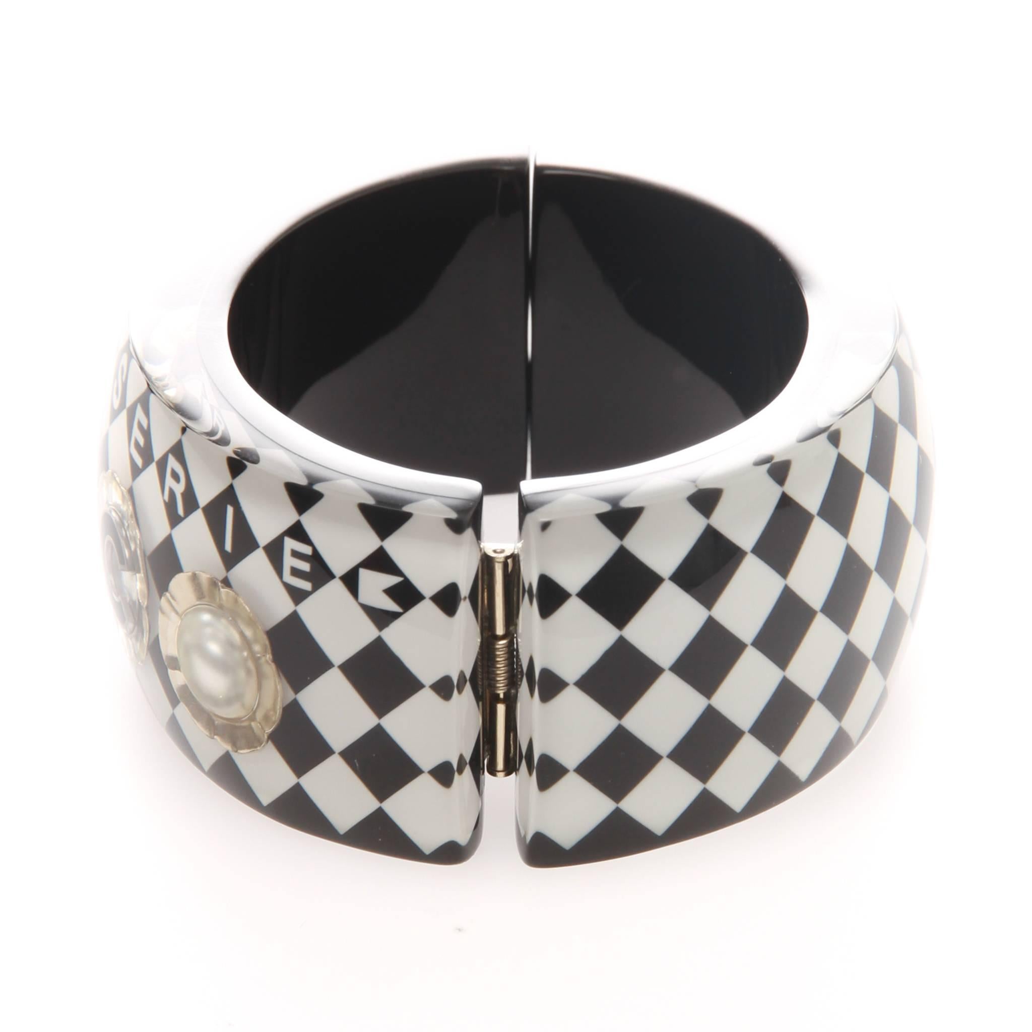 CHANEL Pearl Embellished COCO Brasserie Cafe Gabrielle Iconic CC Cuff Bracelet made for Fall 2015.

Comes with box