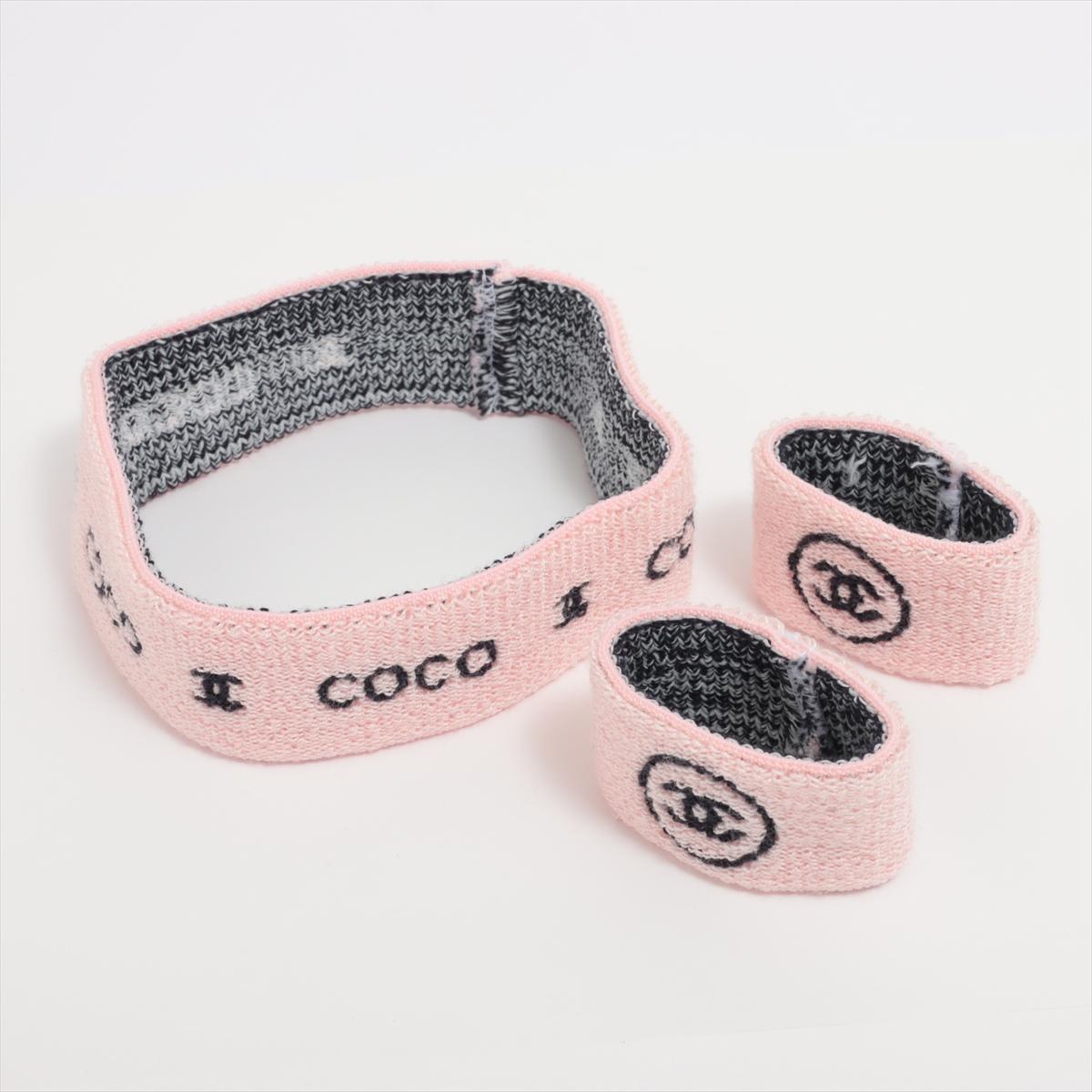 The Chanel Coco CC Logo Knit Headband & Wristband Set in Pink and Black is a chic and stylish accessory duo that effortlessly combines fashion with function. Crafted from a soft and comfortable knit material, the set features a pastel pink base