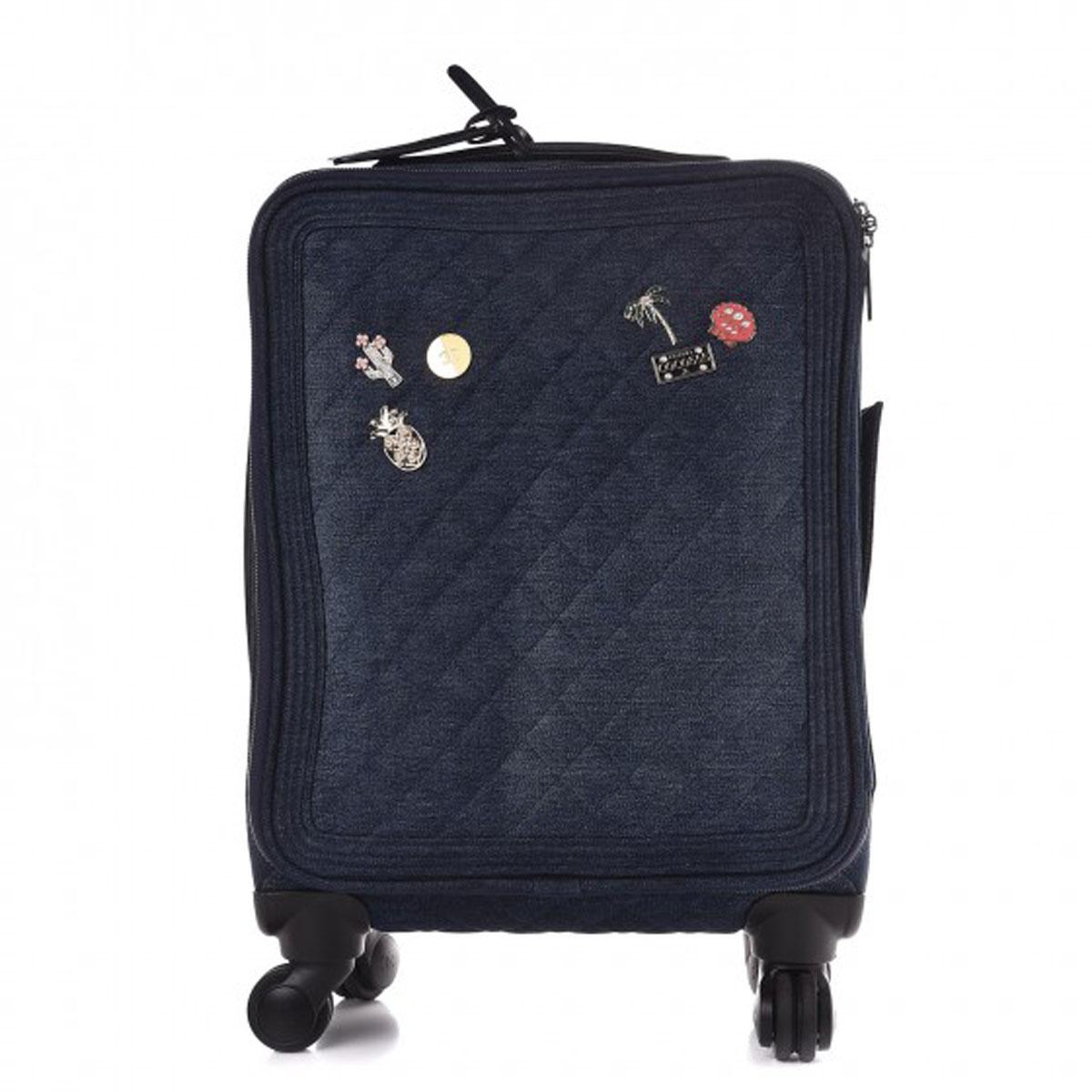 Chanel Coco Charm Denim Trolley Travel Luggage Rolling Carry On

Chanel Cruise 2017
Dark wash blue denim
Silver-tone hardware
Retractable handle dual flat handles at top and side
Wheels at base black Caviar leather trim
Printed woven lining, three