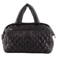 Chanel Cocoon Bowlingtasche aus gestepptem, bedrucktem Nylon Medium