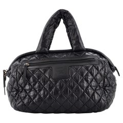 Chanel Cocoon Bowlingtasche aus gestepptem, bedrucktem Nylon Medium