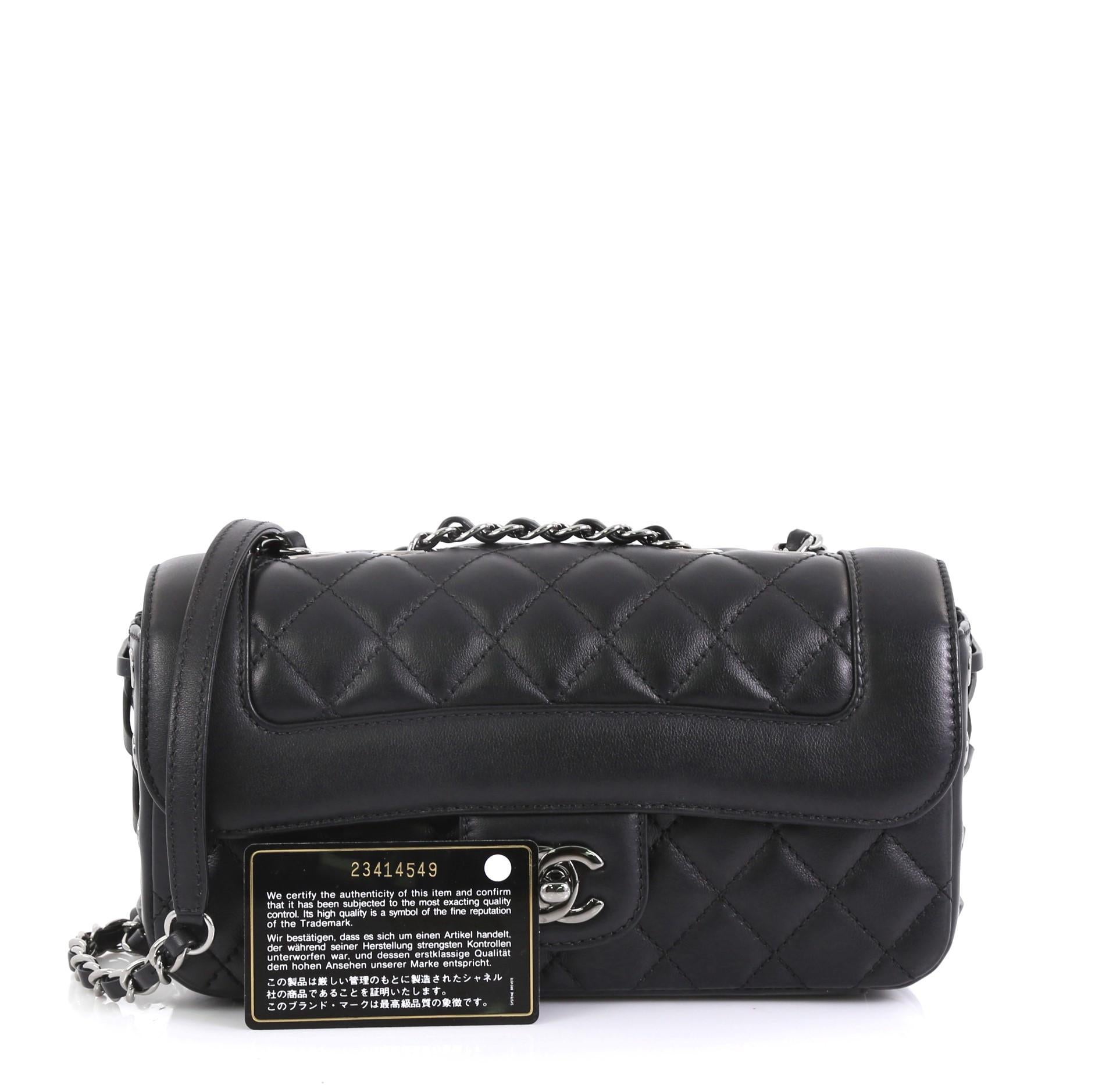 This Chanel Coco Corset Flap Bag Quilted Lambskin Small, crafted from black quilted lambskin leather, features woven-in leather chain strap, corset style leather lacing at the sides and gunmetal-tone hardware. Its CC turn-lock closure opens to a
