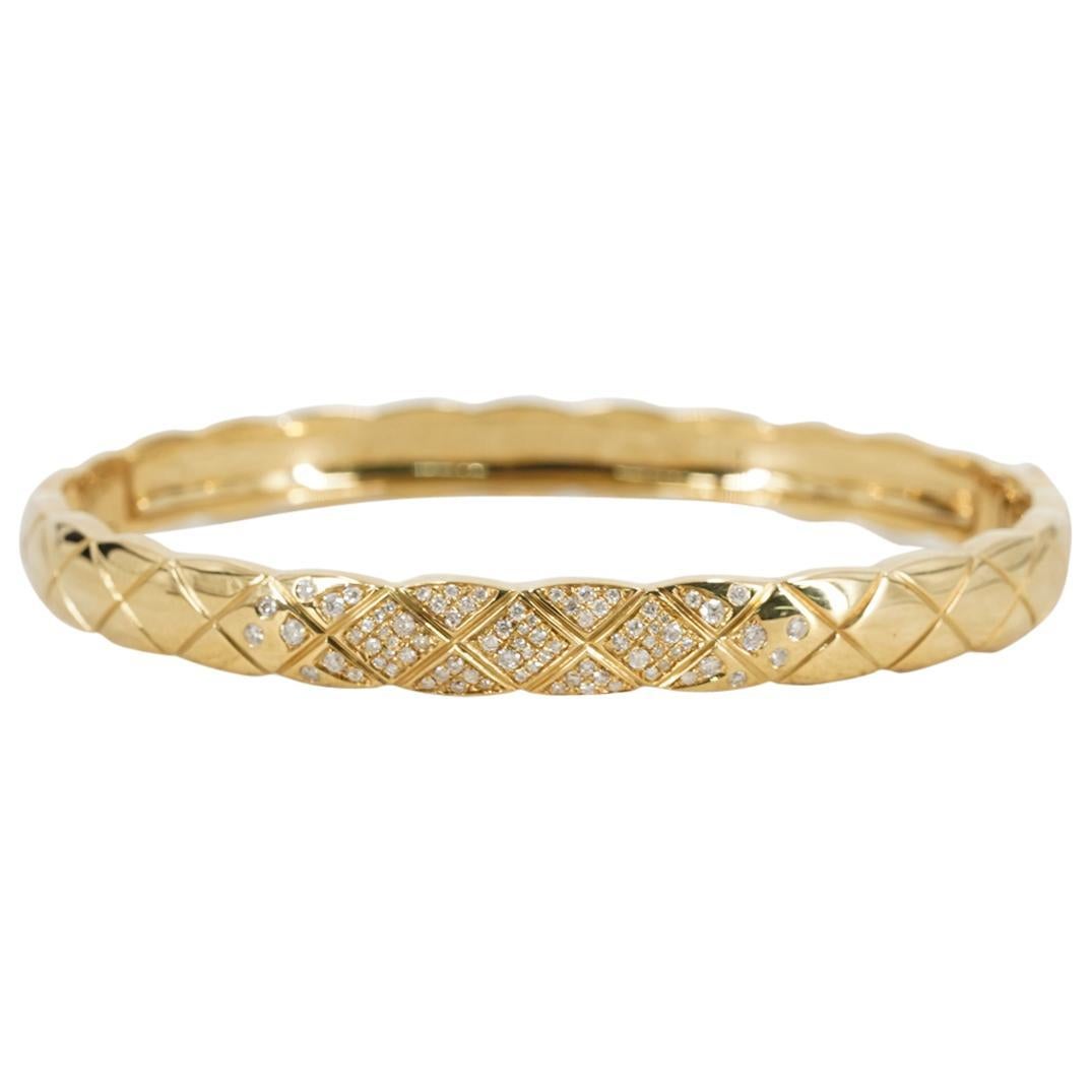 Chanel Coco Crush 18k & .25 ctw Diamond Bangle Bracelet with Box. Classic Chanel Quilted Motif. Excellent Condition. Marked “Chanel” “Au750” “Y637178”. Retails $12,000 +\-.