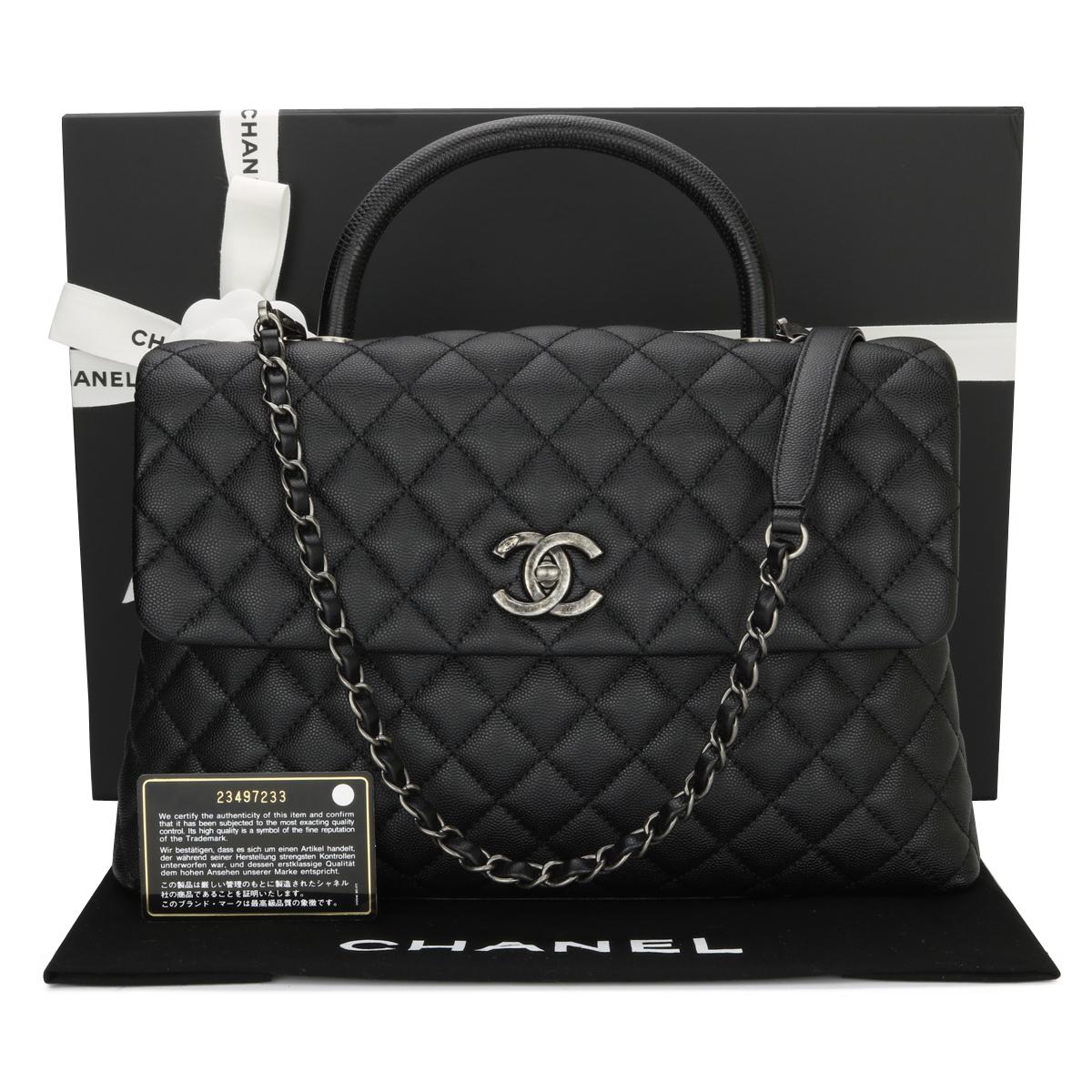 CHANEL Coco Top Handle Bag Large Black Caviar in Lizard Handle with Ruthenium Hardware 2017.

This bag is in excellent condition, the bag still holds its original shape, and the hardware is still very shiny.

This top handle bag is simply gorgeous