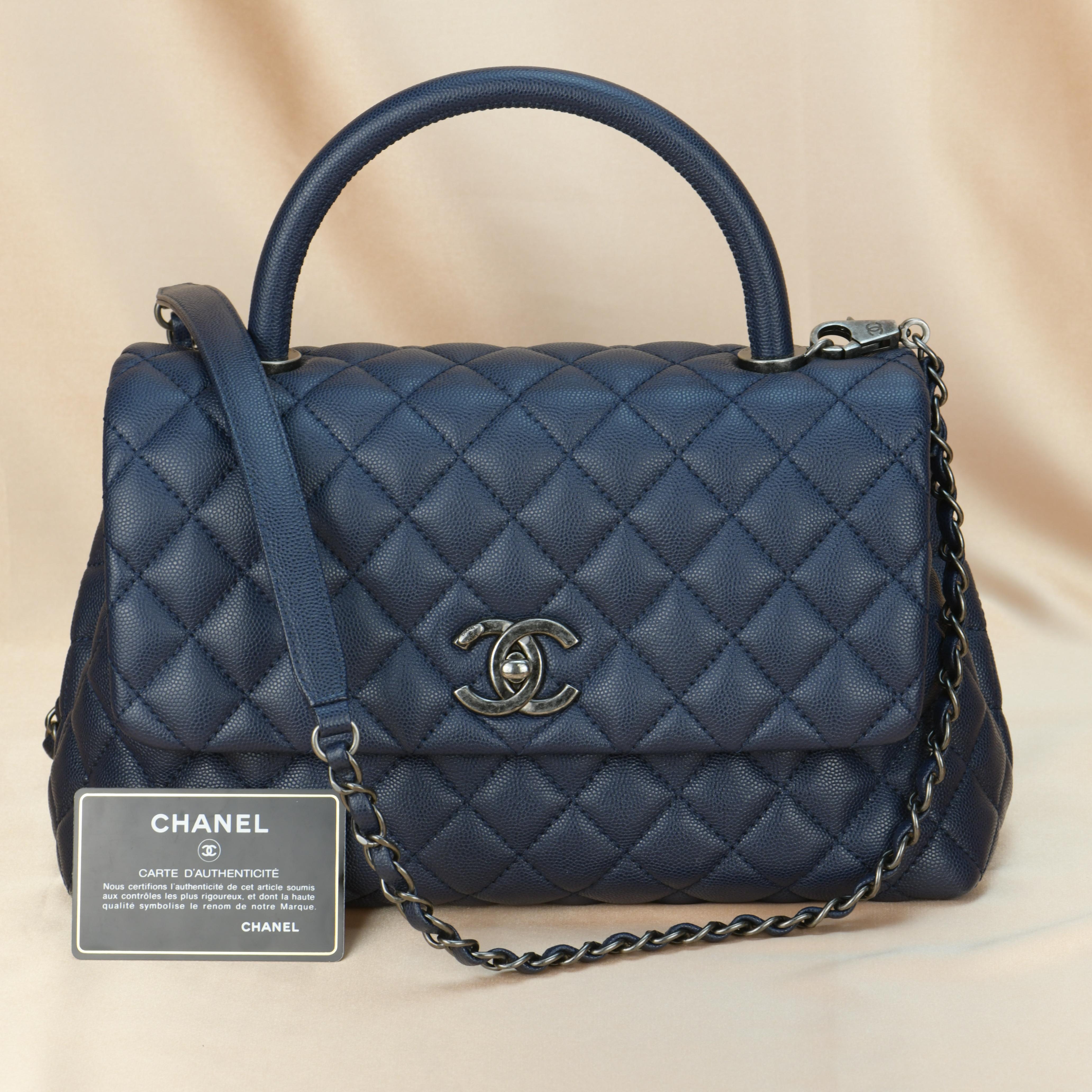 Brand	Chanel
Model	Coco Handle
Serial No.	23******
Color	Navy Blue
Date	Approx. 2016
Metal	Silver 
Material	Caviar Calfskin
Measurements    Approx. 33 x 21 x 12cm
Condition	Excellent 
Comes with	Chanel Dust bag and Authentic Card

If you are