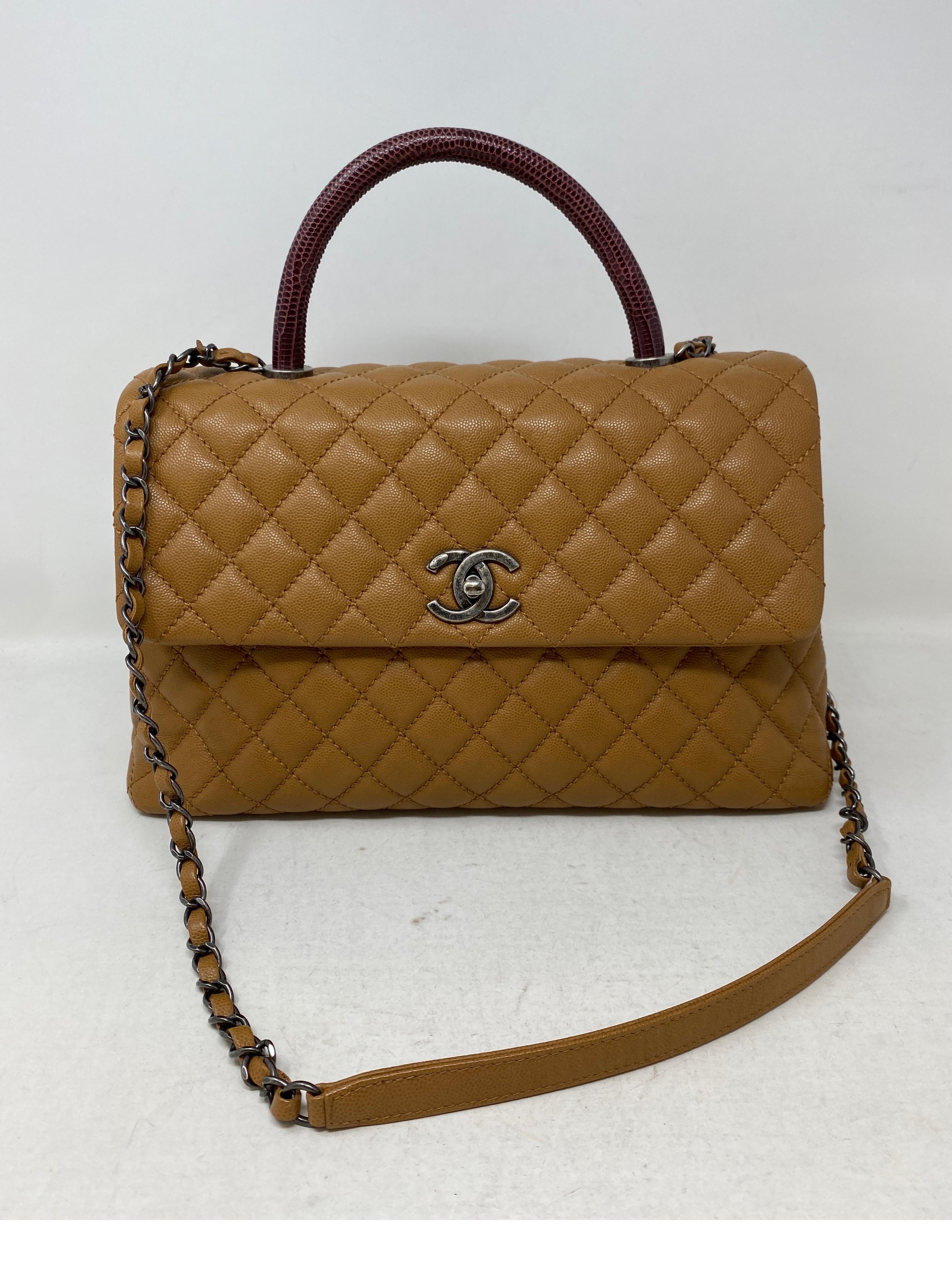 Chanel Coco Lizard Handle Bag. Tan leather bag with ruthenium hardware. Burgundy Lizard handle bag. Excellent like new condition. Rare combination bag. Includes authenticity card and dust cover. Guaranteed authentic. 