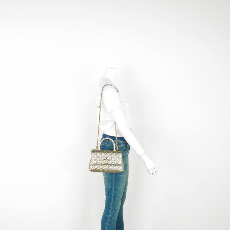 Chanel Coco Handle Small Metallic Caviar Leather Gold Hardware, 2019
These are professional photos of the actual bag offered by Luxbags.
CONDITION: EXCELLENT
Light rubbing around the corners, strap, flap and scratches to the hardware.