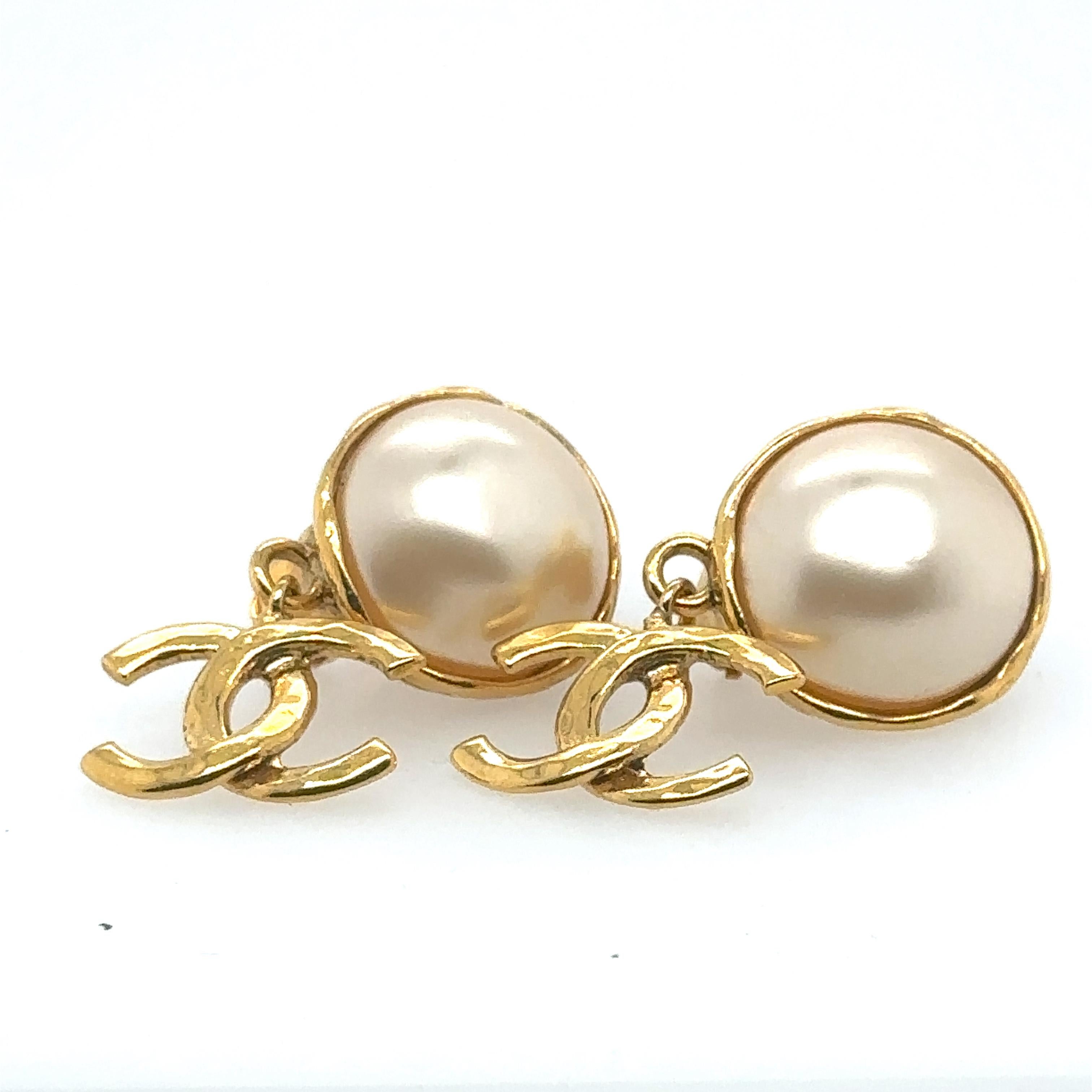 Chanel Coco Mark 95P Gold Plated Imitation Pearl Clip on Earrings. 
4.3 cm x 2.1 cm. 
Total weight is 21.9 grams. 