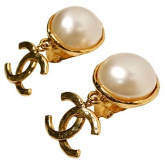 Chanel Coco Mark Gold Plated Costume Pearl CC Dangle Earrings circa 1993