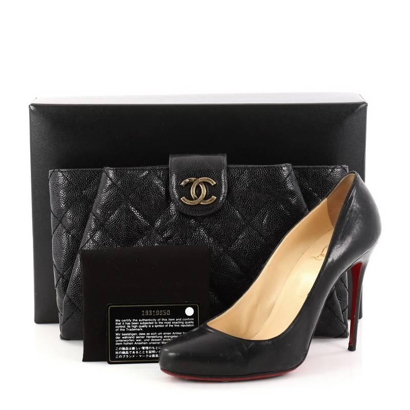This authentic Chanel Coco Pleats Clutch Quilted Glazed Caviar is a stand-out piece from the Coco Pleats collection. Crafted from black quilted glazed caviar leather, this luxurious clutch features CC logo flap closure and aged gold-tone hardware