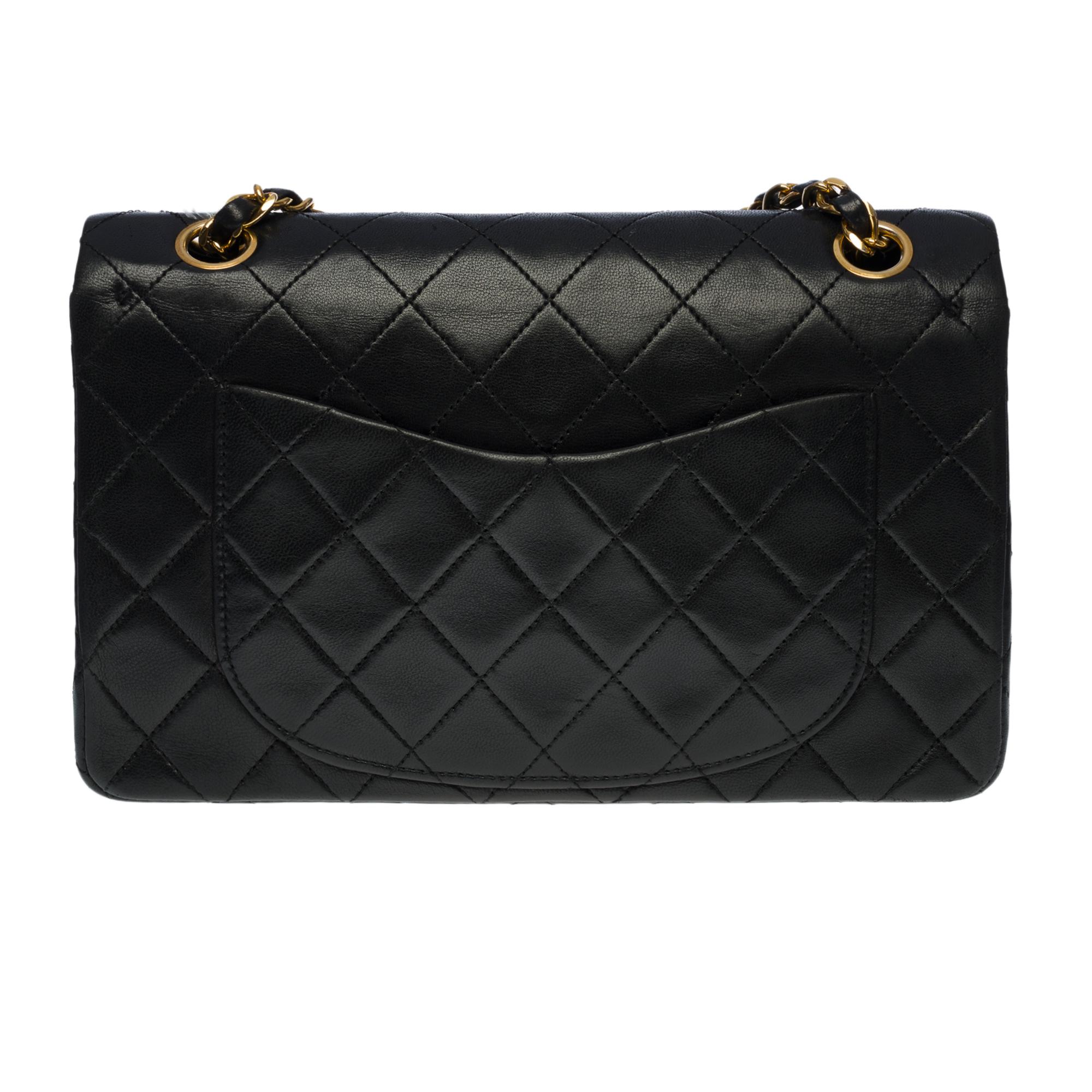 The coveted Chanel Timeless 23cm double flap bag in black quilted leather, gold-tone hardware, a gold-tone chain handle interlaced with black leather for shoulder and shoulder strap
Backpack pocket
Flap closure, gold CC logo clasp
Double flap
Zip on