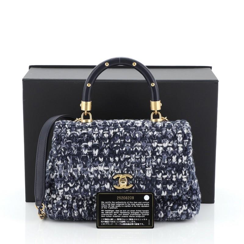 This Chanel Coco Top Handle Bag Crochet with Lambskin Mini, crafted in multicolor crochet with blue lambskin leather, features a single loop leather handle and matte gold-tone hardware. Its CC turn-lock closure opens to neutral fabric interior.