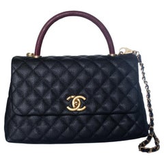 Chanel, coco top handle bag in black caviar leather