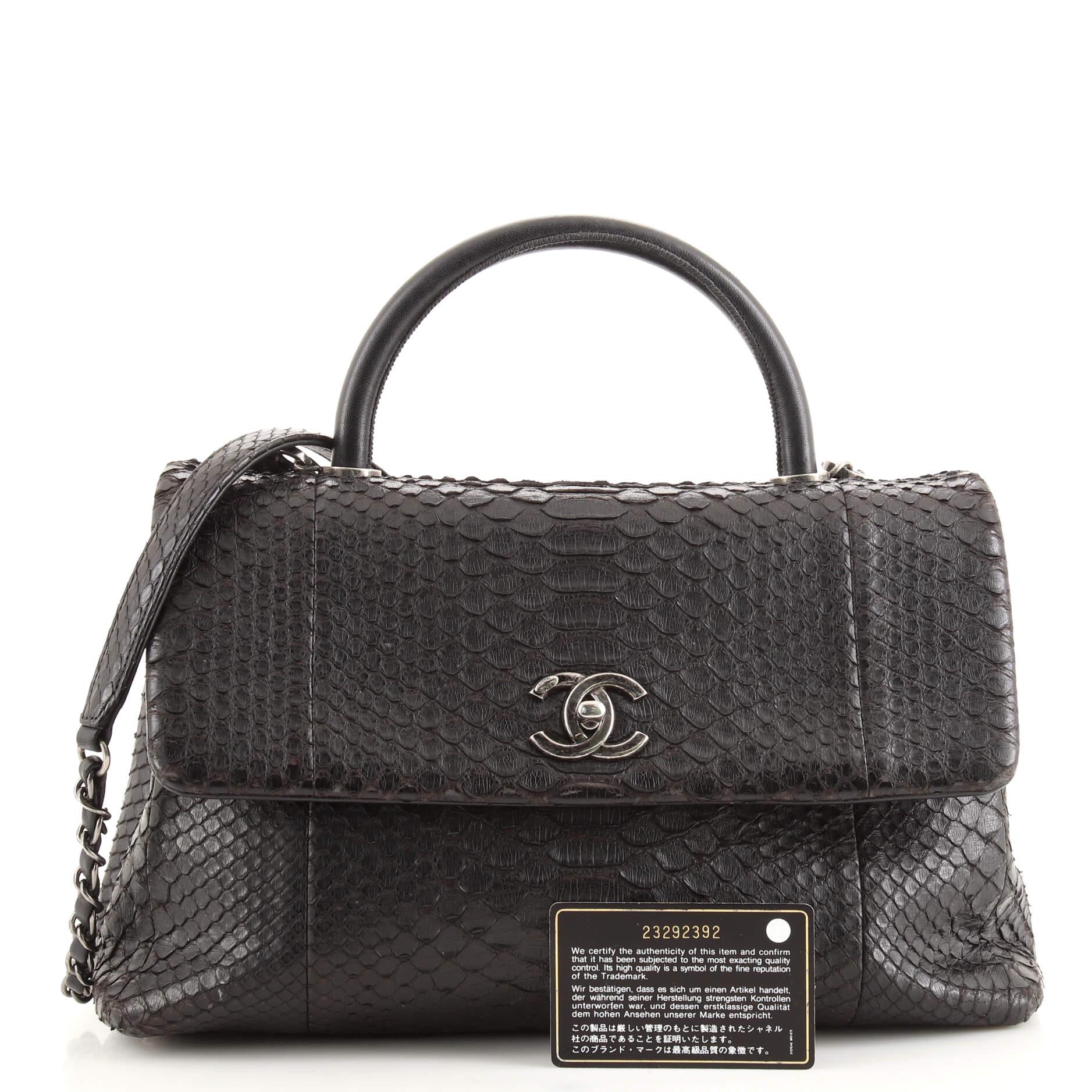 Condition: Good. Creasing and lifting of scales on exterior and shoulder pad, heavy wear on base corners, wear, scuffs and marks on handle, underneath flap and in interior. Indentations underneath flap, pilling on interior zipper tape, scratches on