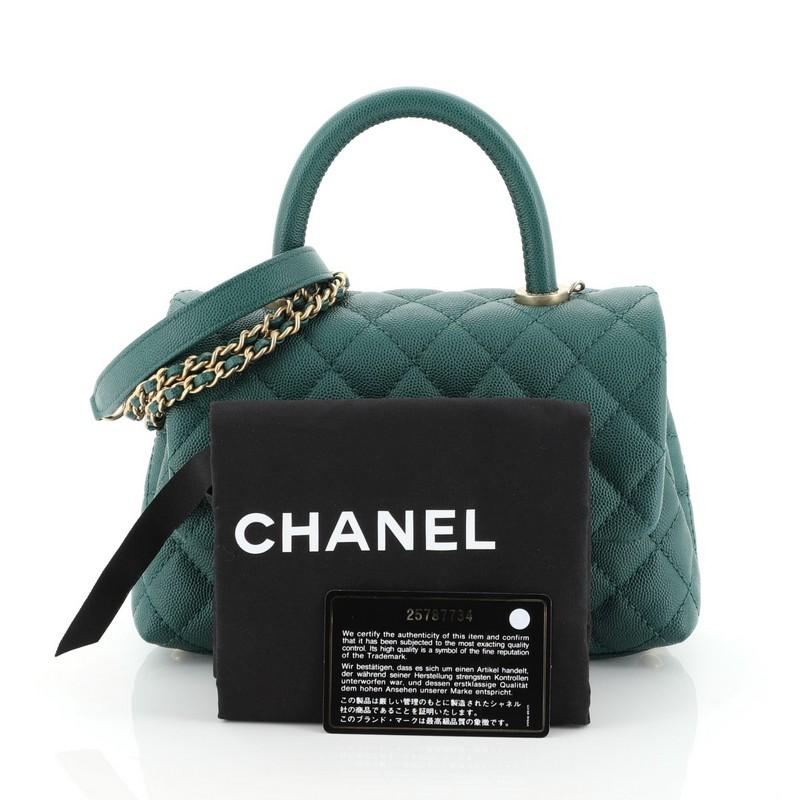 This Chanel Coco Top Handle Bag Quilted Caviar Mini, crafted in green quilted caviar leather, features a single loop leather handle and matte gold-tone hardware. Its CC turn-lock closure opens to green fabric interior. Hologram sticker reads: