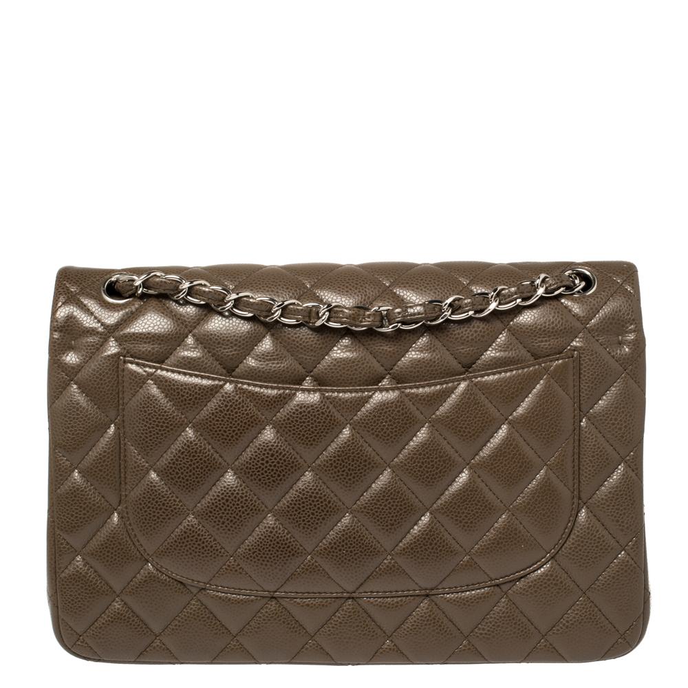 We are in utter awe of this flap bag from Chanel as it is appealing in a surreal way. Exquisitely crafted from coffee brown caviar leather in their quilt design, it bears their signature label on the leather interior and the iconic CC turn-lock on