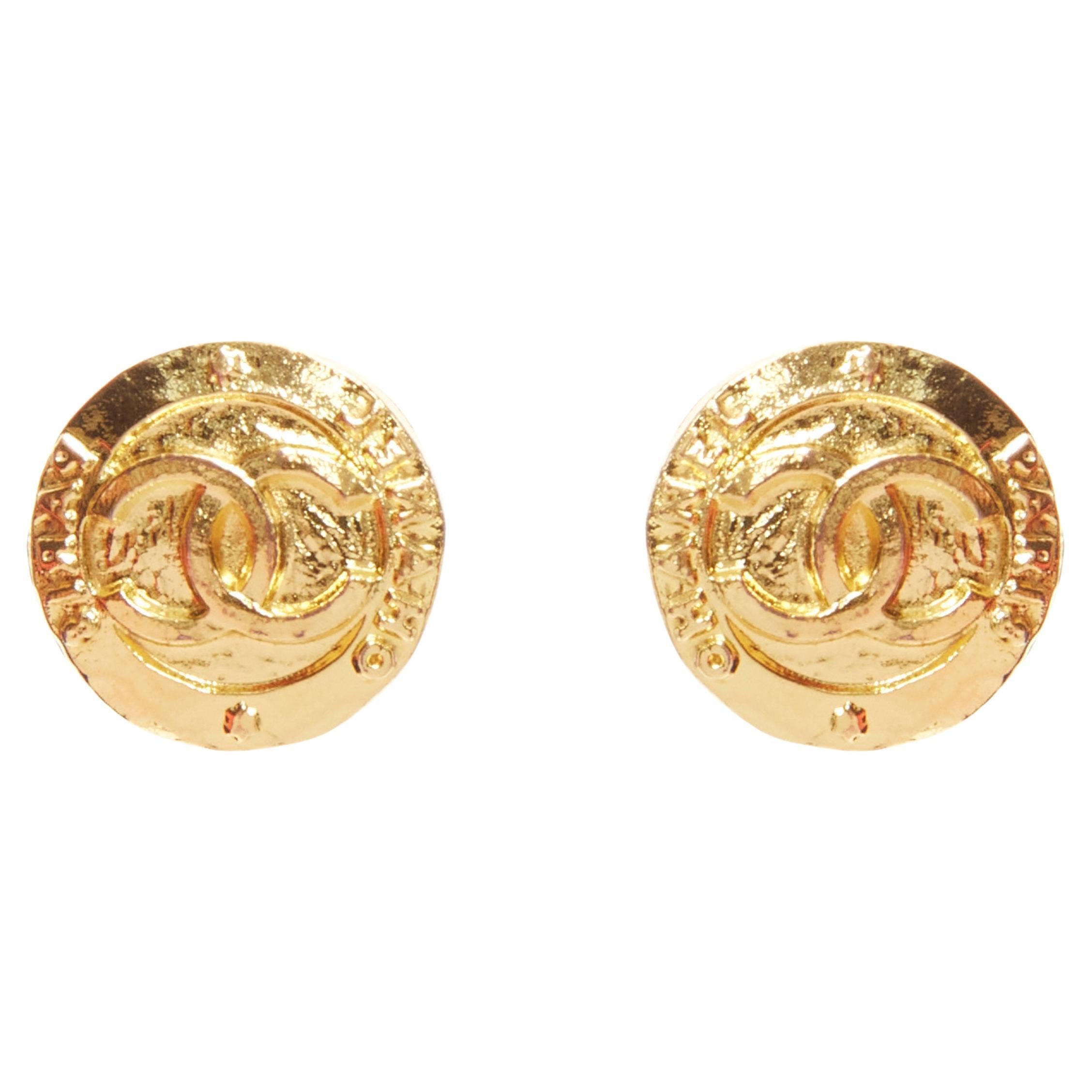 CHANEL Collection 28 Vintage gold tone CC logo coin medallion clip on earring