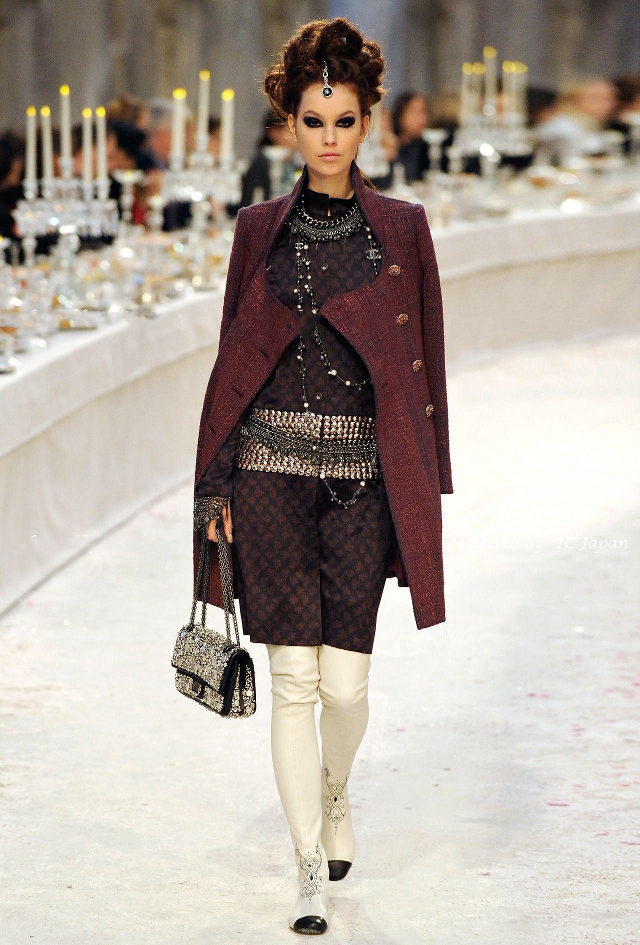 Absolutely stunning Chanel tweed coat featuring 20! jewel buttons -
from Metiers d'Art ''Paris - Bombay'' Collection. as seen on Catwalk Look # 38. Retail price was over 11,000 US$. Size mark 48 FR