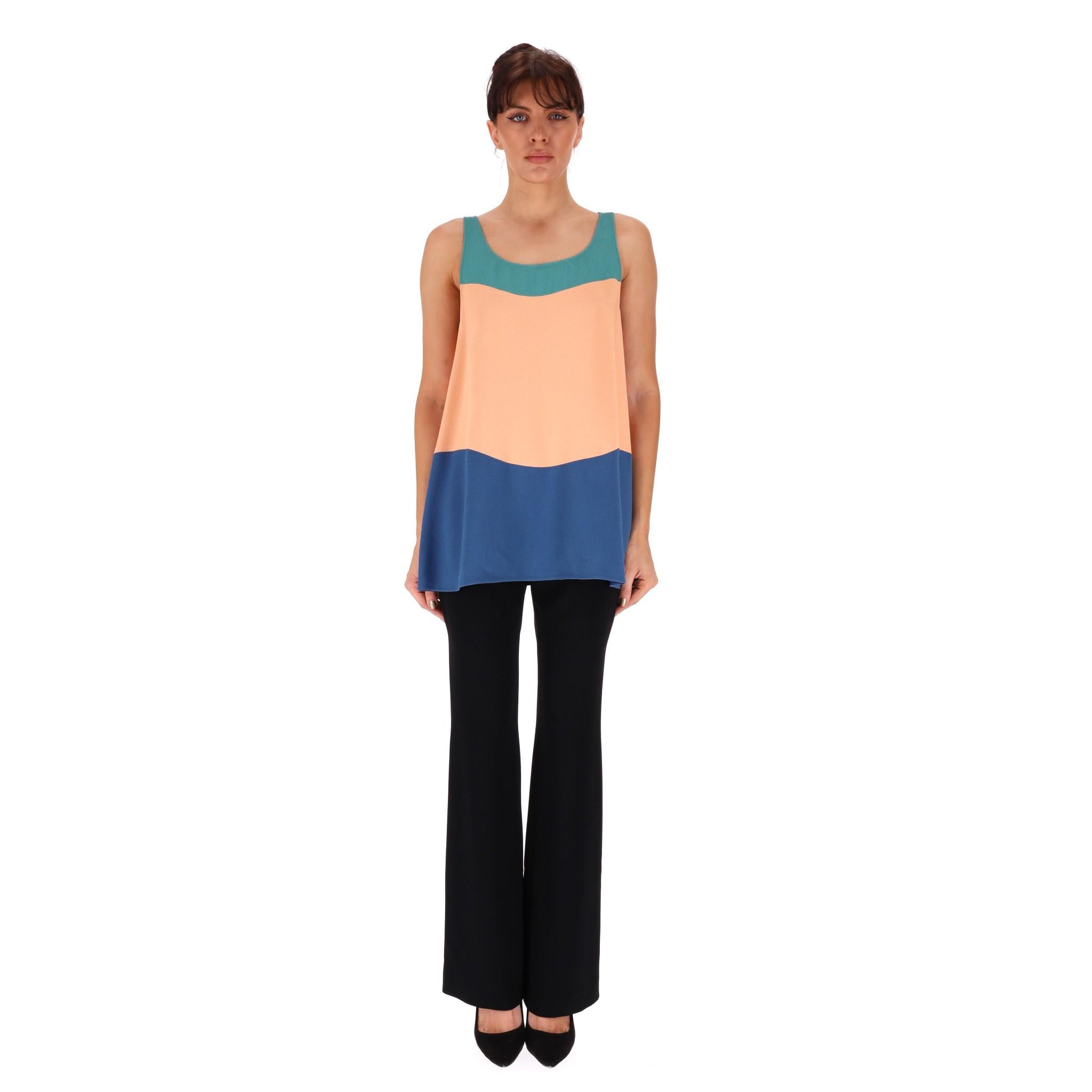 Chanel Colour-Block Top With 'CC' Logo Pearl Buttons

Striped colour-block designed sleeveless top with 'CC' logo faux pearl button closure to the shoulders.

Round neckline and loose-fit silhouette.

From Spring 2014 Collection. Rrp Approx.