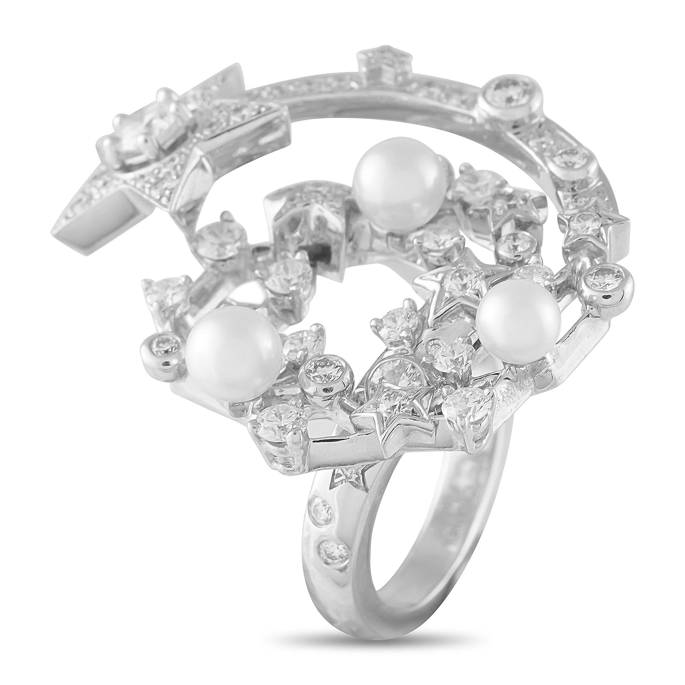 This Chanel Comete ring full of life and full of movement. Elevated by Diamonds totaling 1.25 carats and stunning Pearl accents, the top of the design is covered in a sparkling constellation of stars. Set in 18K White Gold, it features a 4mm wide