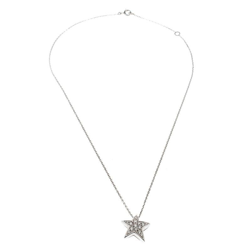 The use of shooting stars and constellations by Chanel can be traced back to years as far as 1932. The 5 point shape is translated well in this gorgeous necklace. It is made from 18k white gold and the chain holds a star pendant set with 14 diamonds