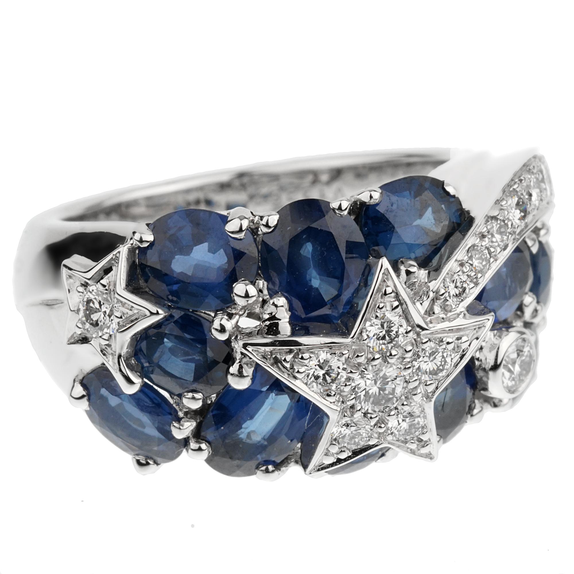 An iconic Chanel cocktail ring from the Comete collection showcasing deep blue sapphires and the iconic stars adorned with round brilliant cut diamonds in 18k white gold. The ring measures a size 5 3/4 and can be resized.