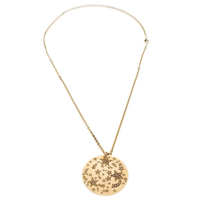 The use of shooting stars and constellations by Chanel can be traced back to years as far as 1932. The 5 point shape is translated well in this gorgeous necklace. It is created from 18k yellow gold, and the chain holds a circular pendant set with