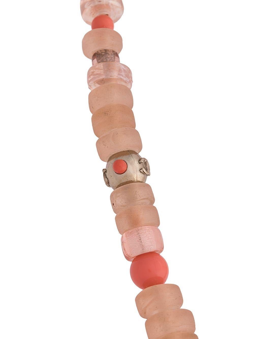 Crafted in France, this elegant, pre-owned necklace from Chanel is a unique piece that adds a touch of classic sophistication to any outfit and features an intricate combination of baby-pink crystal embellishments, coral-coloured glass beads, white