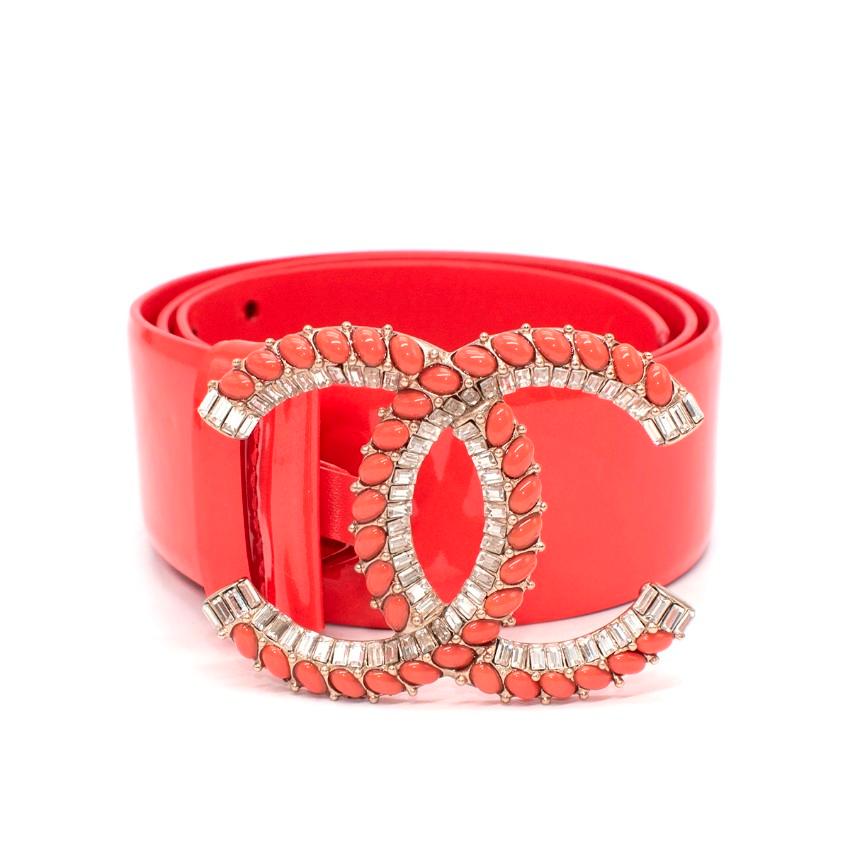  Chanel Coral Patent Leather CC Embellished Belt

- Vibrant coral hued glossy patent leather 
- Gold-tone CC buckle with tonal stones and crystals
-  Press-stud closure, fully adjustable
- Can be styled up or dressed down