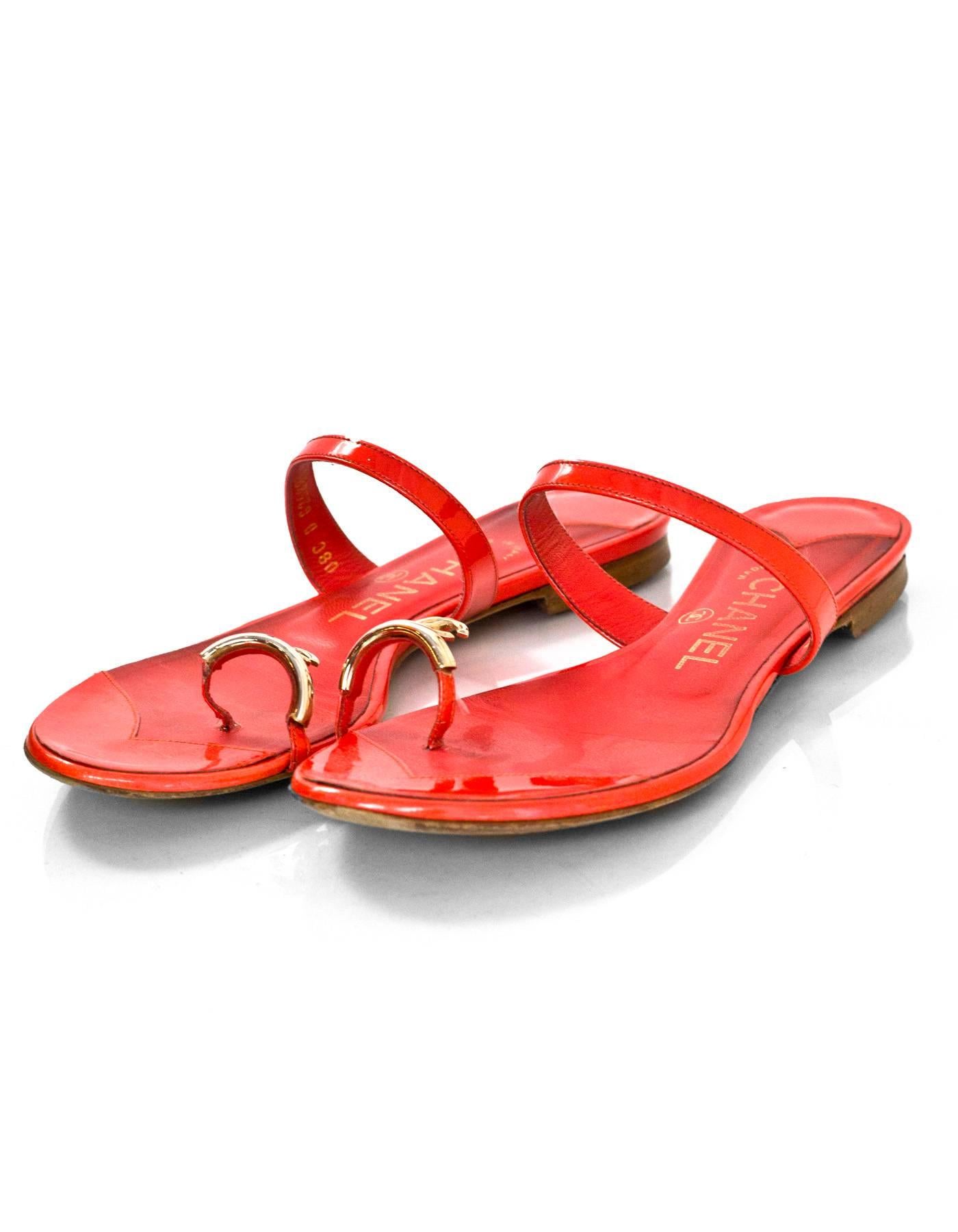 Chanel Coral Patent Leather CC Toe Sandals Sz 36

Made In: Italy
Color: Coral
Materials: Patent leather
Closure/Opening: Side on
Sole Stamp: CC Made in Italy 36
Overall Condition: Very good pre-owned condition with the exception of moderate soiling