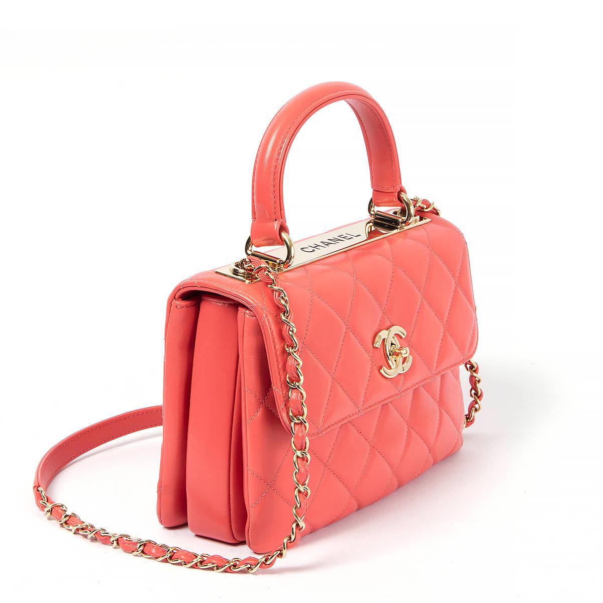 100% authentic Chanel Trendy CC Small Top Handle Bag in coral pink lambskin with gold hardware and metal plate engraved with 