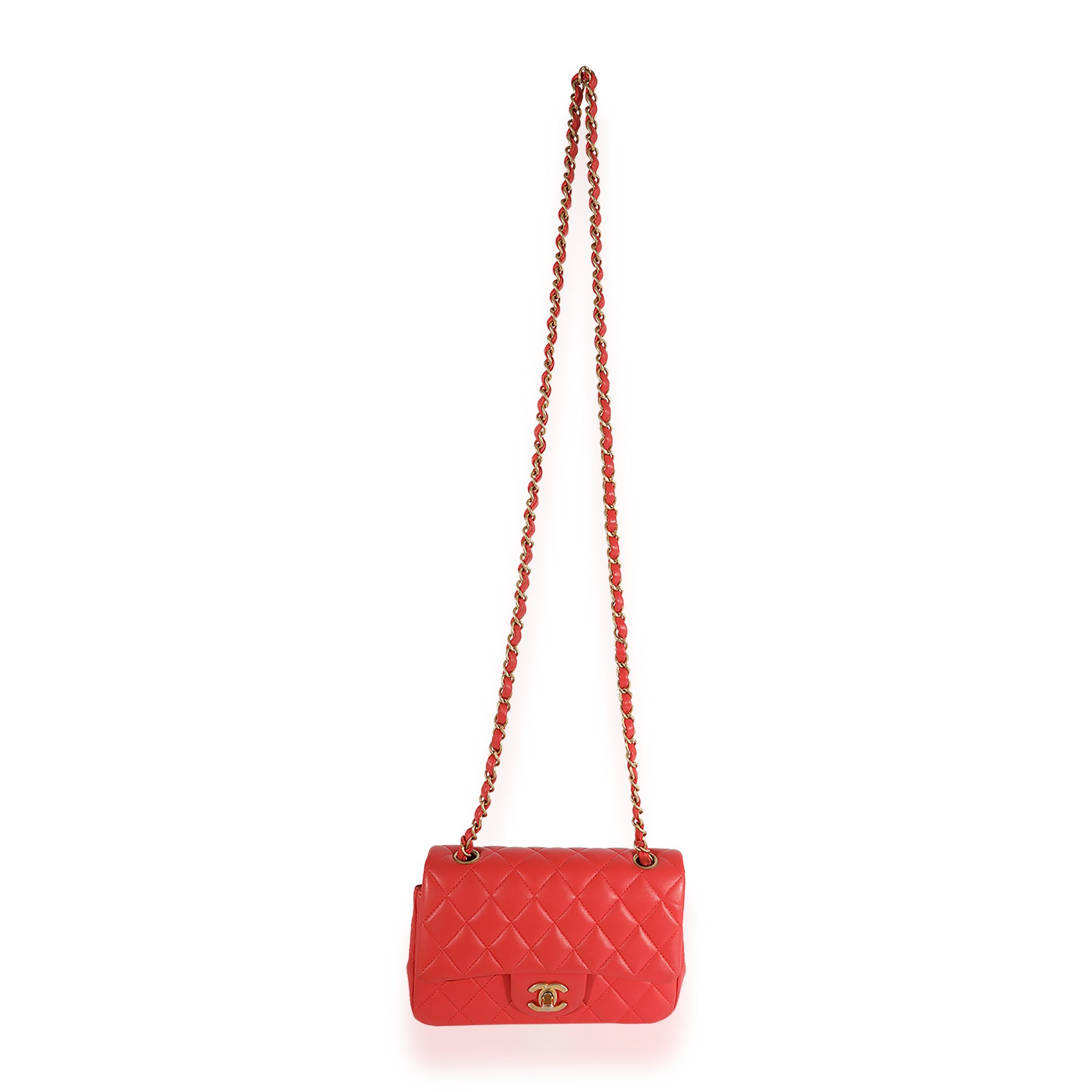 Listing Title: Chanel Coral Quilted Lambskin Mini Rectangular Classic Flap Bag
SKU: 124077
Condition: Pre-owned 
Handbag Condition: Mint
Condition Comments: Plastic at some hardware. Scuffing and discoloration at straps. Faint corner scuffing and