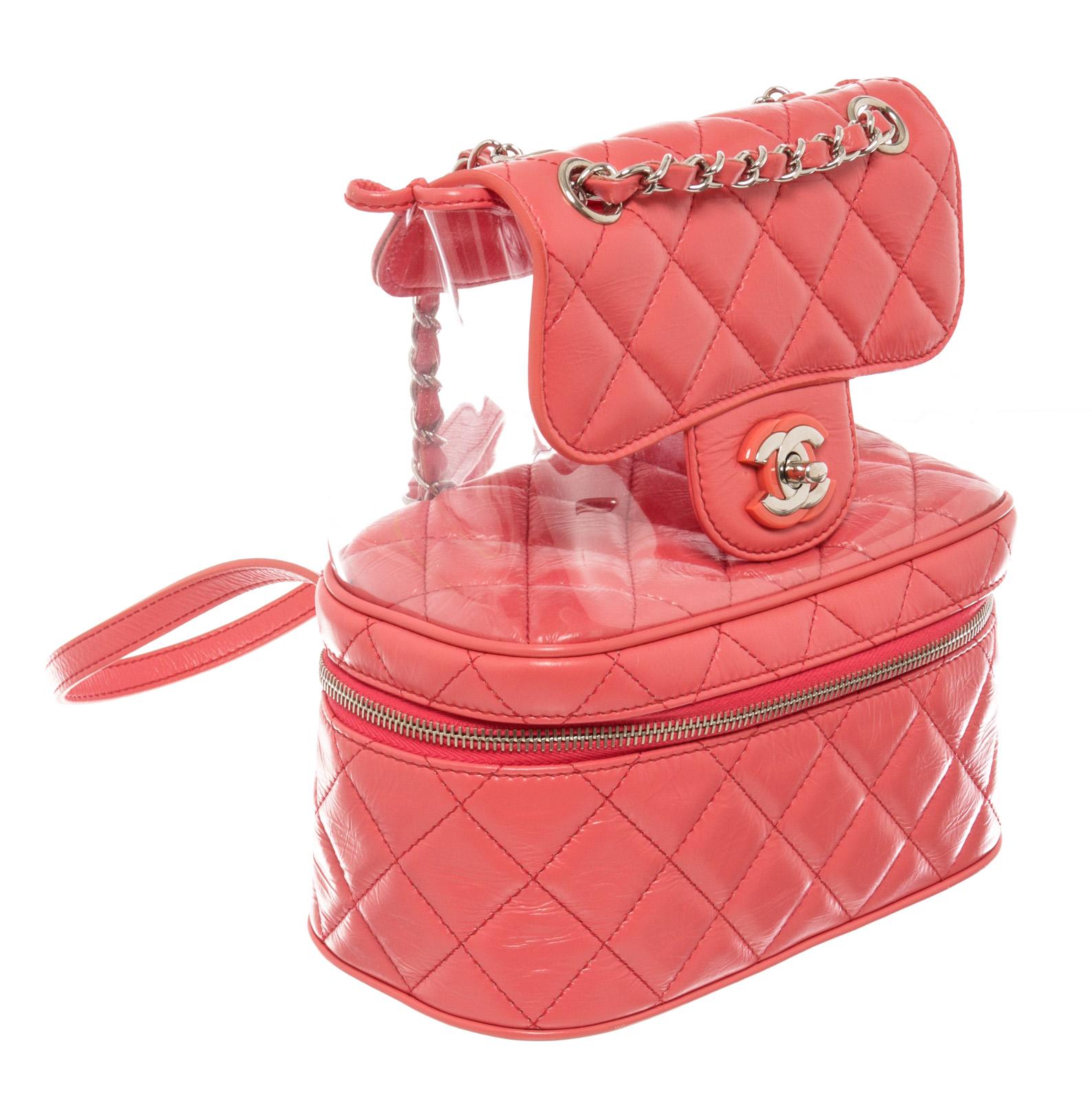 Coral quilted aged leather and clear PVC Chanel Aquarium backpack with silver-tone hardware, chain-link and leather handle, dual adjustable shoulder straps, dual compartments; one with zip closure, tonal grosgrain lining and CC turn-lock closure at