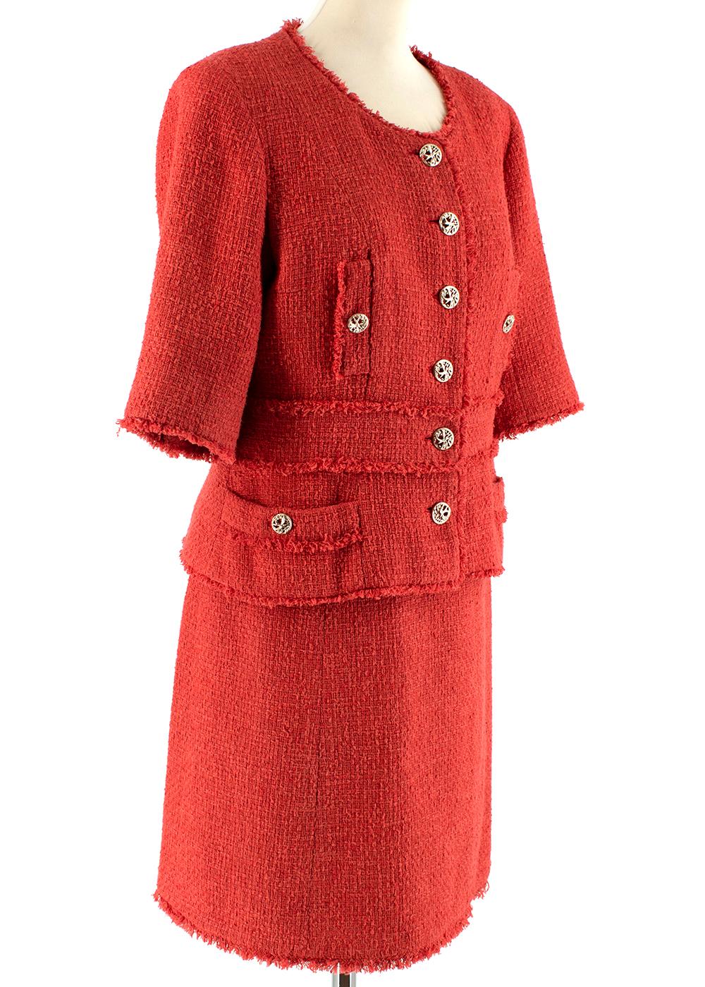 Chanel Red Cotton Blend Tweed Collarless Skirt Suit

-Made of a soft cotton blend 
-Signature tweed texture
-Classic single breasted cut
-Branded gold tone metal buttons depicting birds
-Beautiful fringed effect trims 
-Luxurious silk lining,