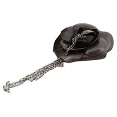 Chanel Corsage Brooch Features Camellia Flower in Black Calfskin Leather