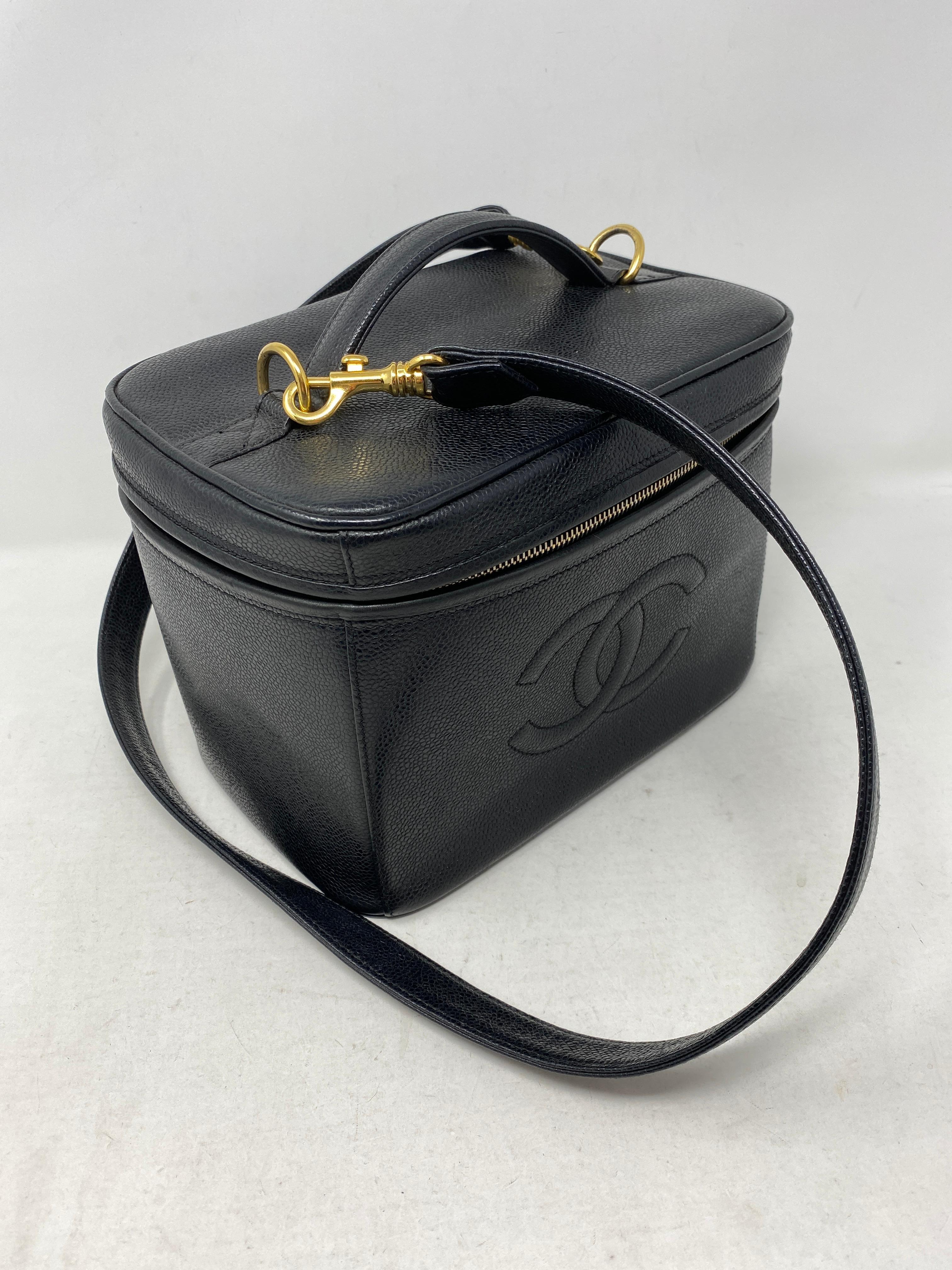 Chanel Cosmetic Case Crossbody Bag. Can be worn as purse or travel bag. Detachable strap. Gold hardware. Caviar leather. Mint condition. Vintage and rare collector's piece. Includes authenticty card. Guaranteed authentic. 