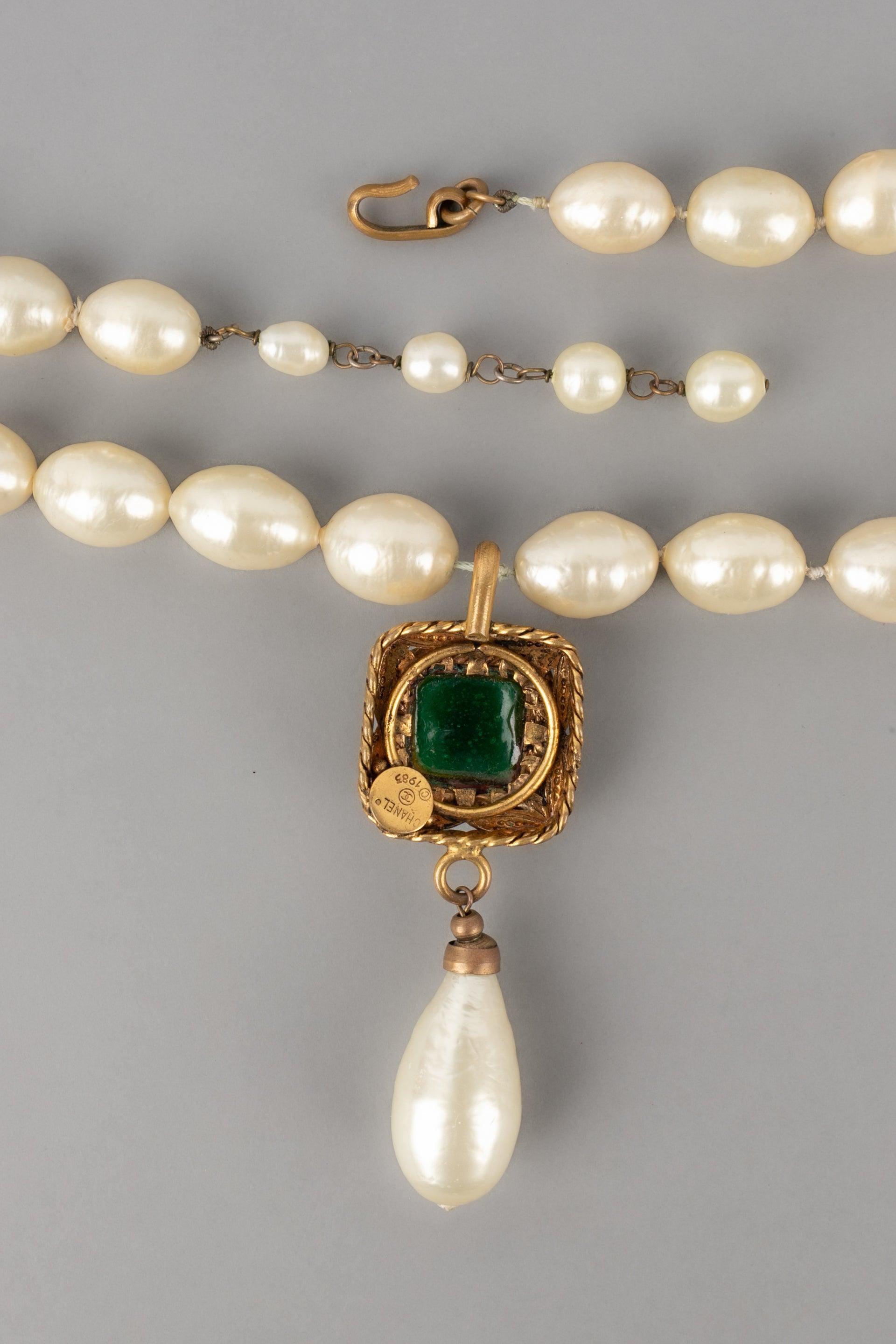 Women's Chanel Costume Pearl Necklace with a Golden Metal Pendant, 1983 For Sale