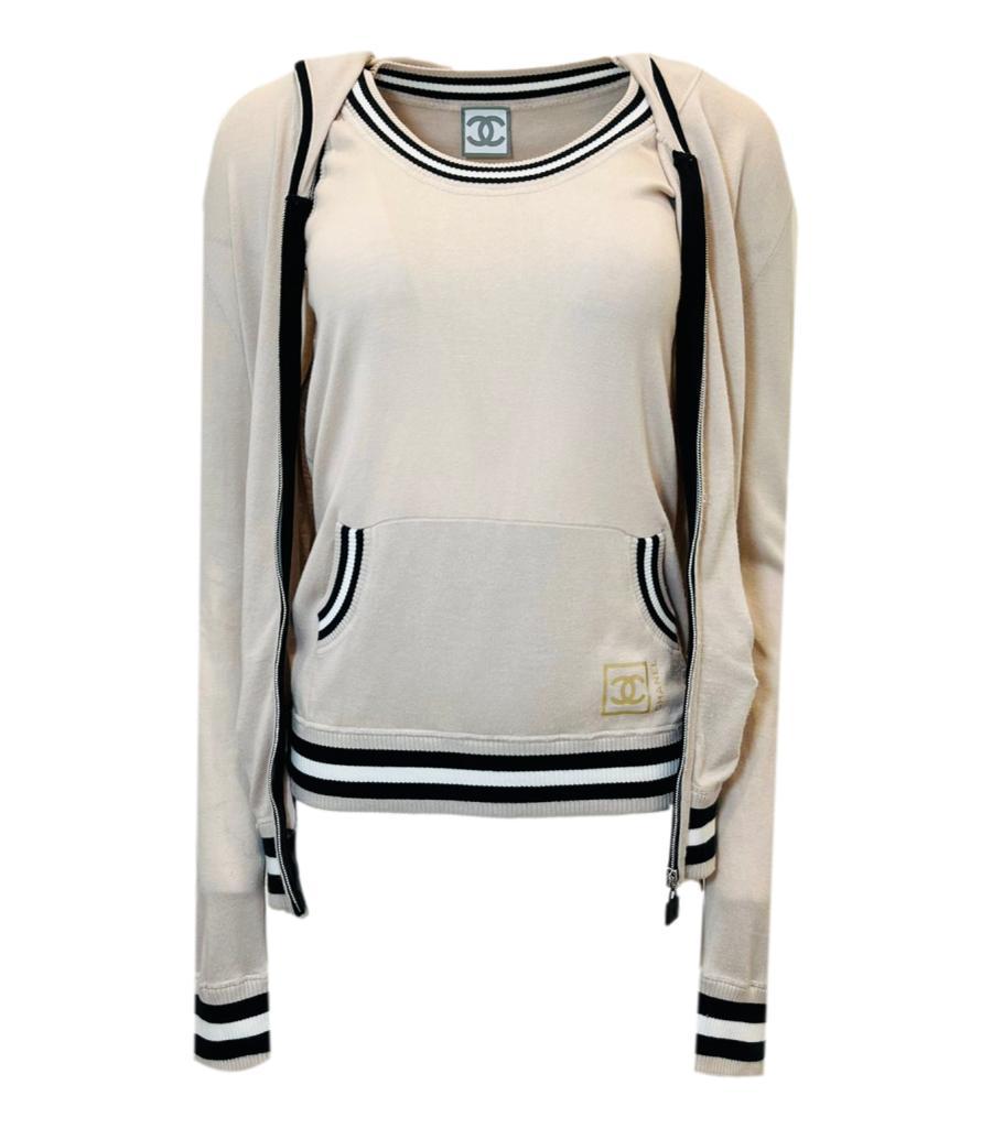 Chanel Sport Cotton Top & Matching Hoodie

Ivory sleeve top top with large 'CC' logo and stripped, ribbed neckline, arms and hem. Matching hoodie with pockets and 'CC' logo pull zipper closure and same stripped trim.

From 2008 collection.

Size -