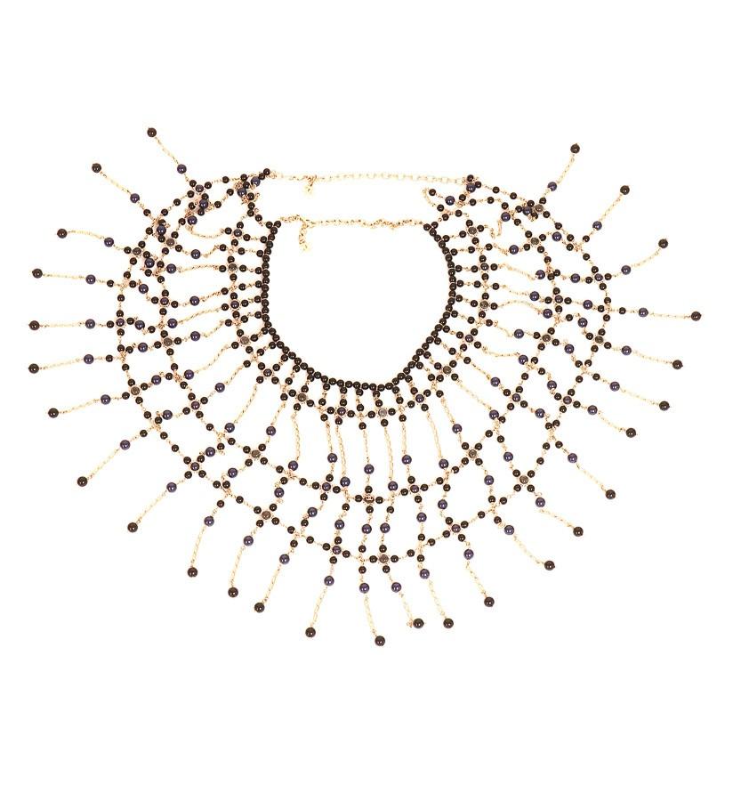 CHANEL COUTURE breastplate with beads. 
The jewel is a magnificent piece that will dress your most sophisticated parties. It is a breastplate that will cover your entire bust (and your back), a succession of bangs of gold metal chains, beaded in