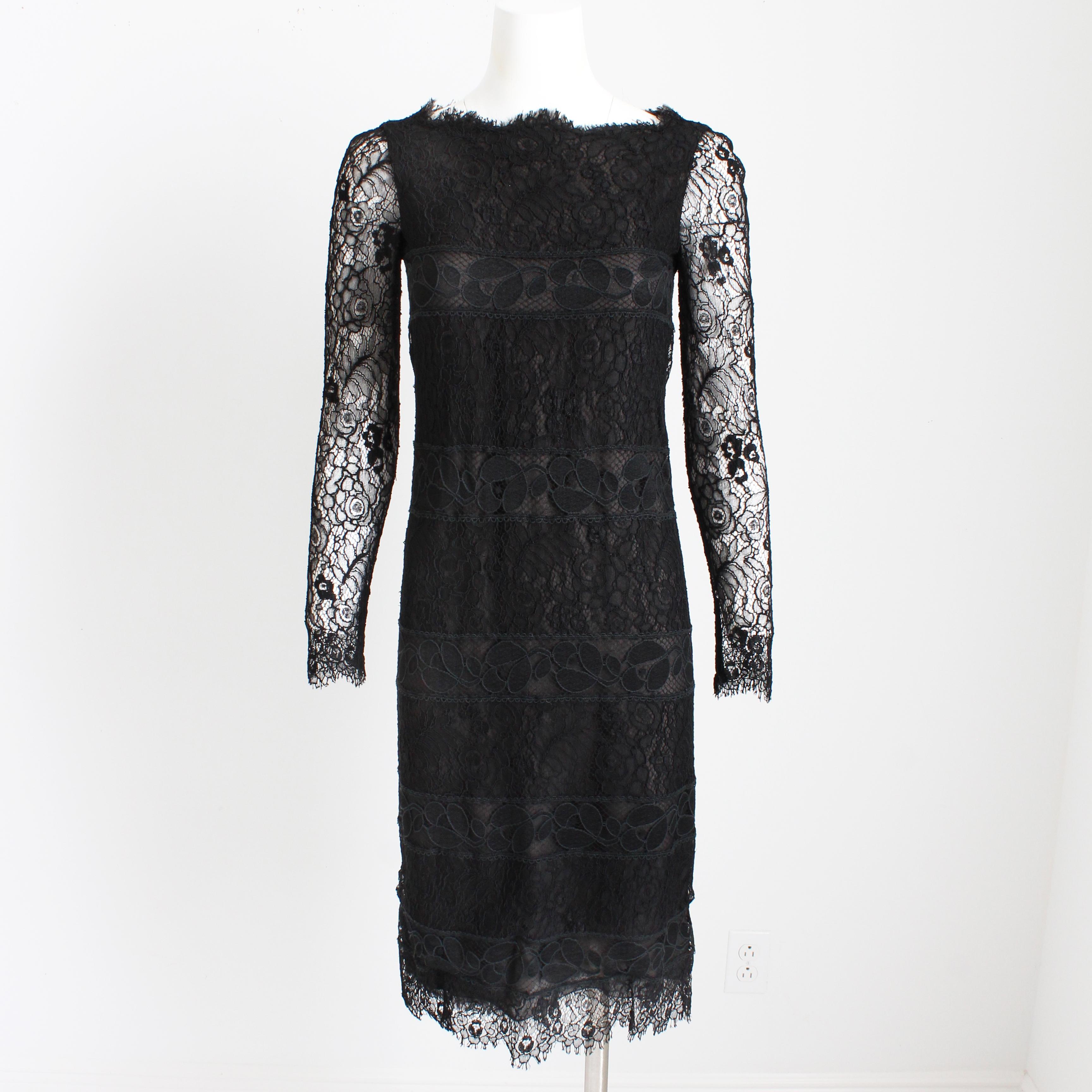 Preowned, vintage Chanel couture cocktail dress, likely made in the early 80s.  Made from silk and linen floral guipure lace over a black silk underdress, it features a scalloped neckline and hem, and fastens with a metal zipper in back.  The