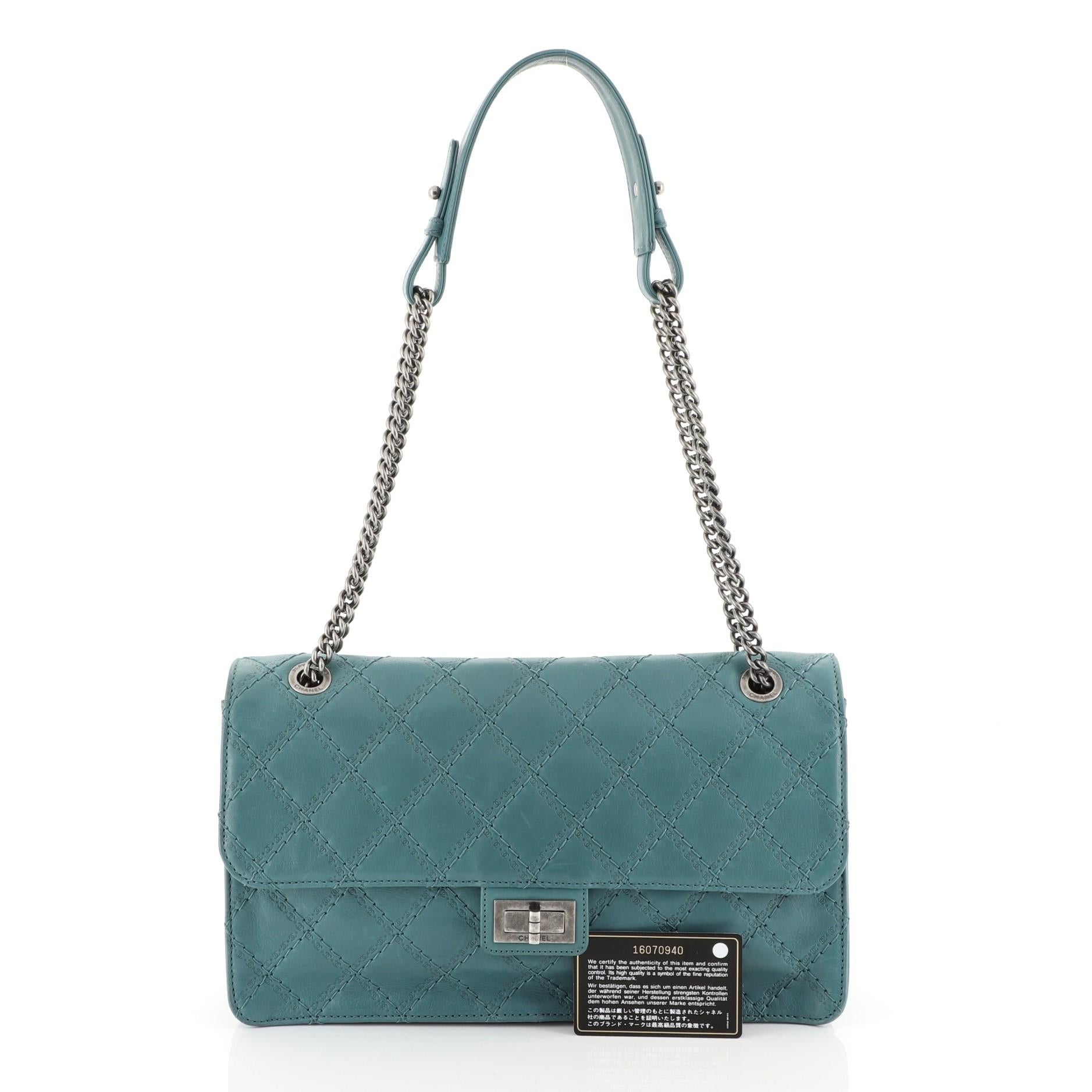 This Chanel Crave Reissue Flap Bag Quilted Calfskin Jumbo, crafted in green quilted calfskin leather, features reissue chain strap with leather pad, front flap and aged silver-tone hardware. Its mademoiselle turn-lock closure opens to a gray fabric