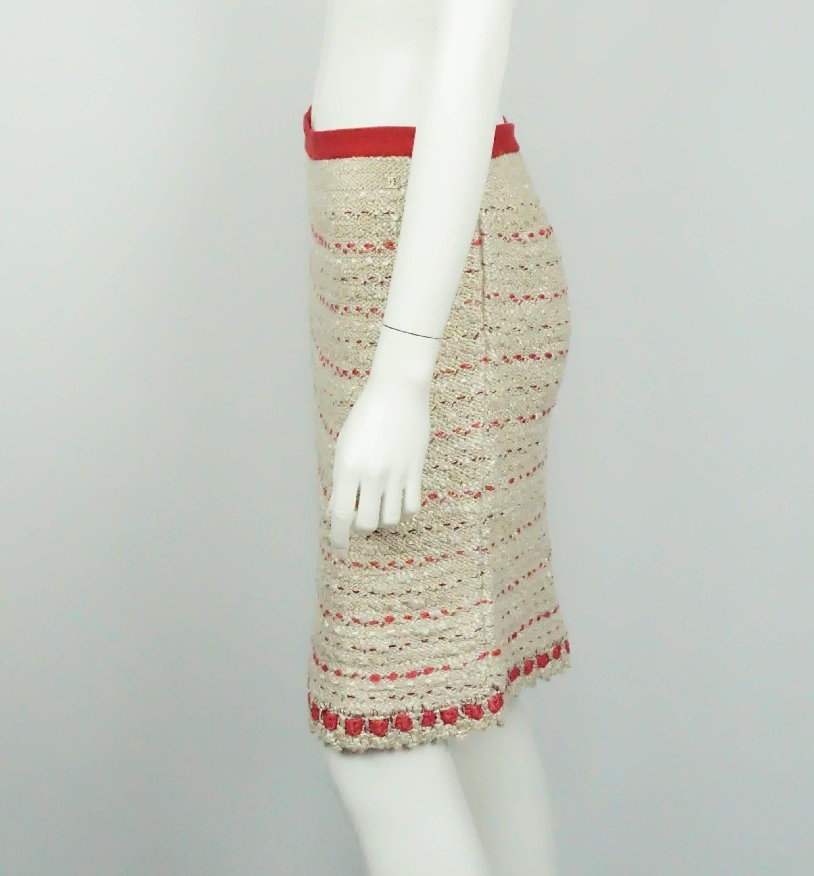 Chanel Cream and Red Silk Knit Skirt  - 38 - 06P  This beautiful Chanel Skirt is made primarily of a silk and cotton blend knit with a horizontal pattern. The skirt has a red knit 1 inch waistband with a side zipper. It has a semi scalloped hemline