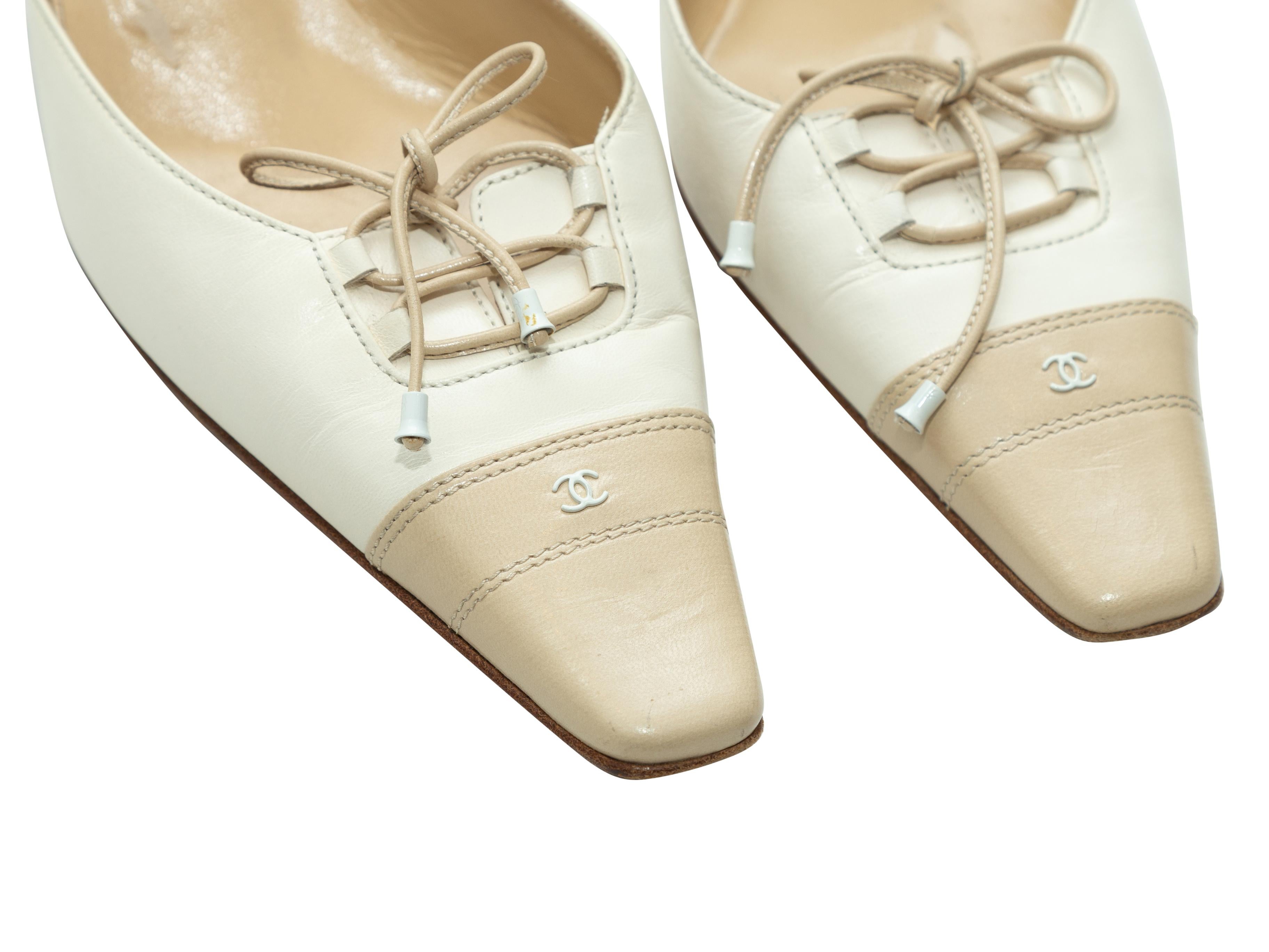Chanel Cream & Beige CC Leather Mules In Good Condition In New York, NY