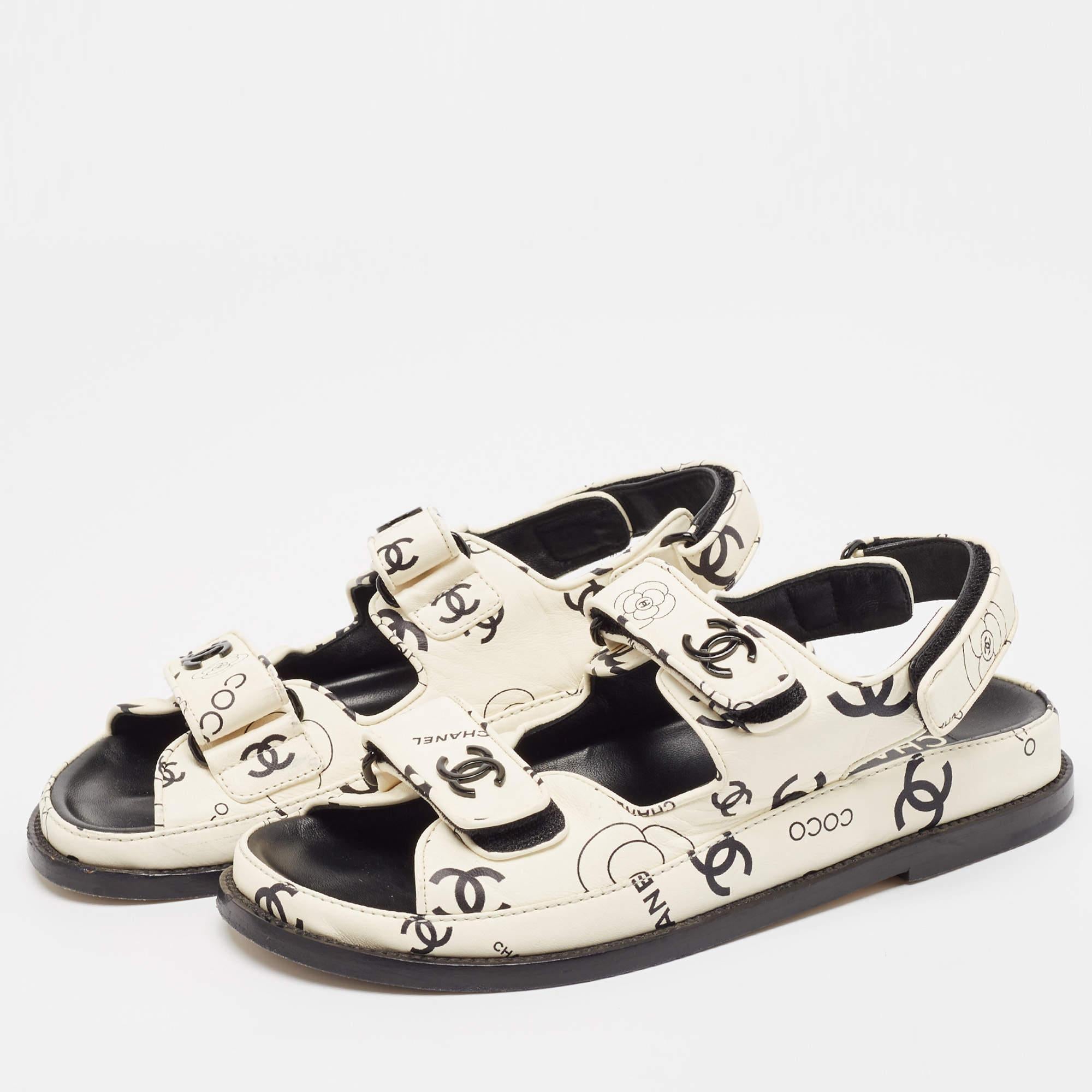 Frame your feet with these Chanel Dad sandals. Created using the best materials  the flats are perfect with short  midi  and maxi hemlines.