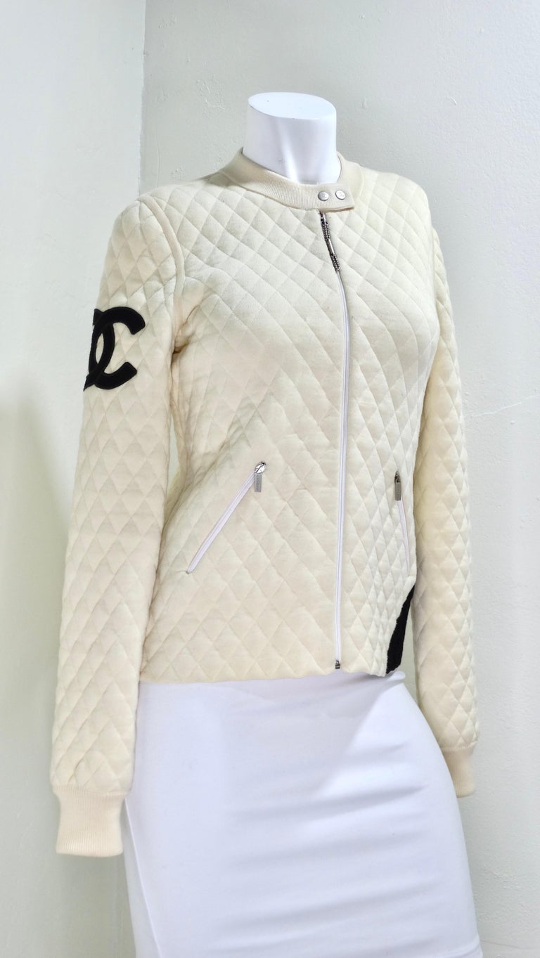 How cool this is Chanel moto-style bomber?! This y2k dream needs to be in your closet. From the 2005 Fall Collection, it features a long sleeve, quilted wool with CC detail at sleeve, hot pink monogrammed interior, dual zip pockets at front and