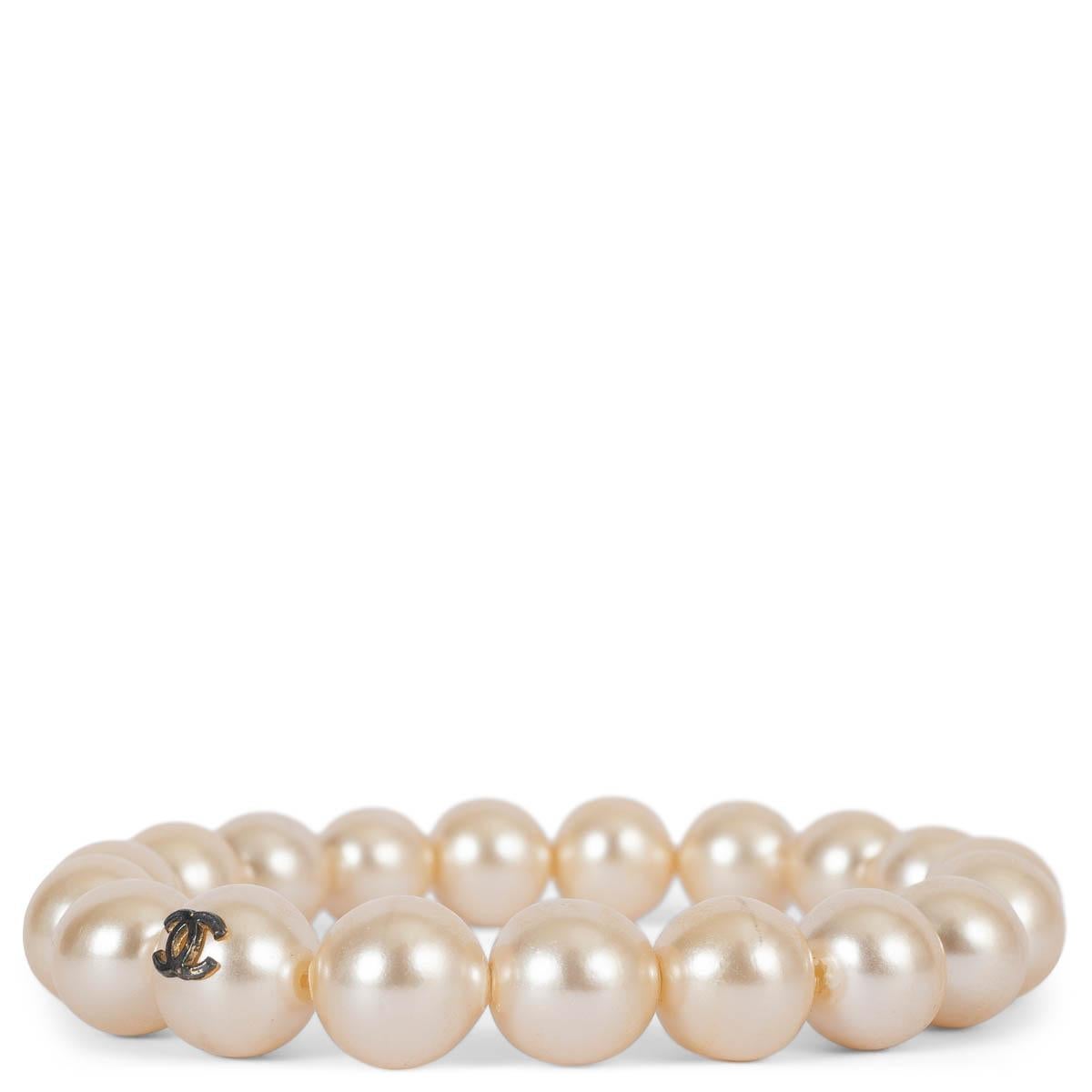 100% authentic Chanel faux pearl elastic bracelet with gunmetal CC on one pearl. Has been worn and is in excellent condition. 

Measurements
Circumference	19.2 (fits large and is elastic)

All our listings include only the listed item unless