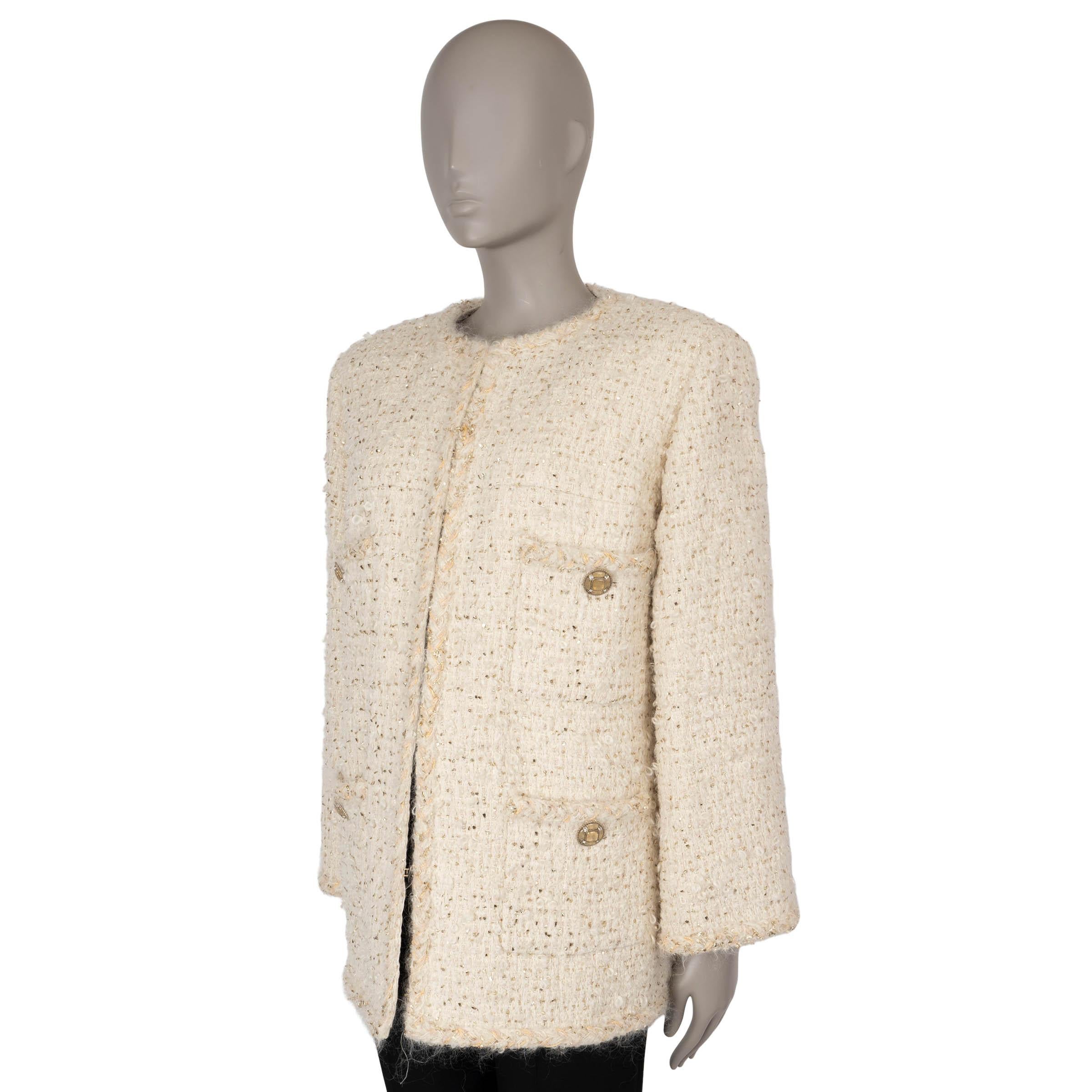 This 100% authentic Chanel tweed jacket is crafted from a luxurious blend of cream wool (40%), mohair (35%), silk (13%), polyamide (7%), and polyester (5%), accented with gold lurex for a subtle shimmer. It features a collarless, oversized, boxy