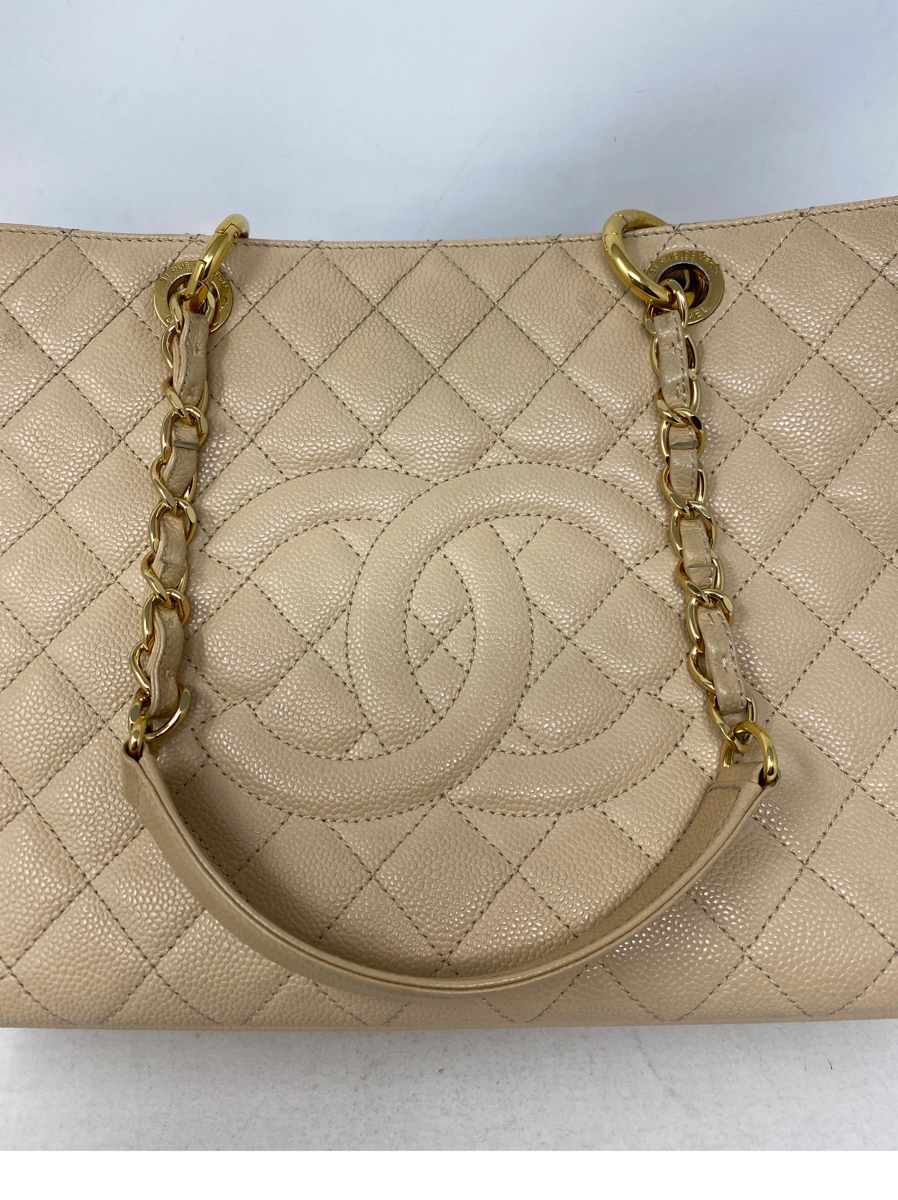 Chanel Cream Grand Shopper Tote Bag. Gold hardware. Caviar leather. Good condition. The GST bags are highly sought after. Retired bag from Chanel. Great addition to your collection. Includes authenticity card. Guaranteed authentic.