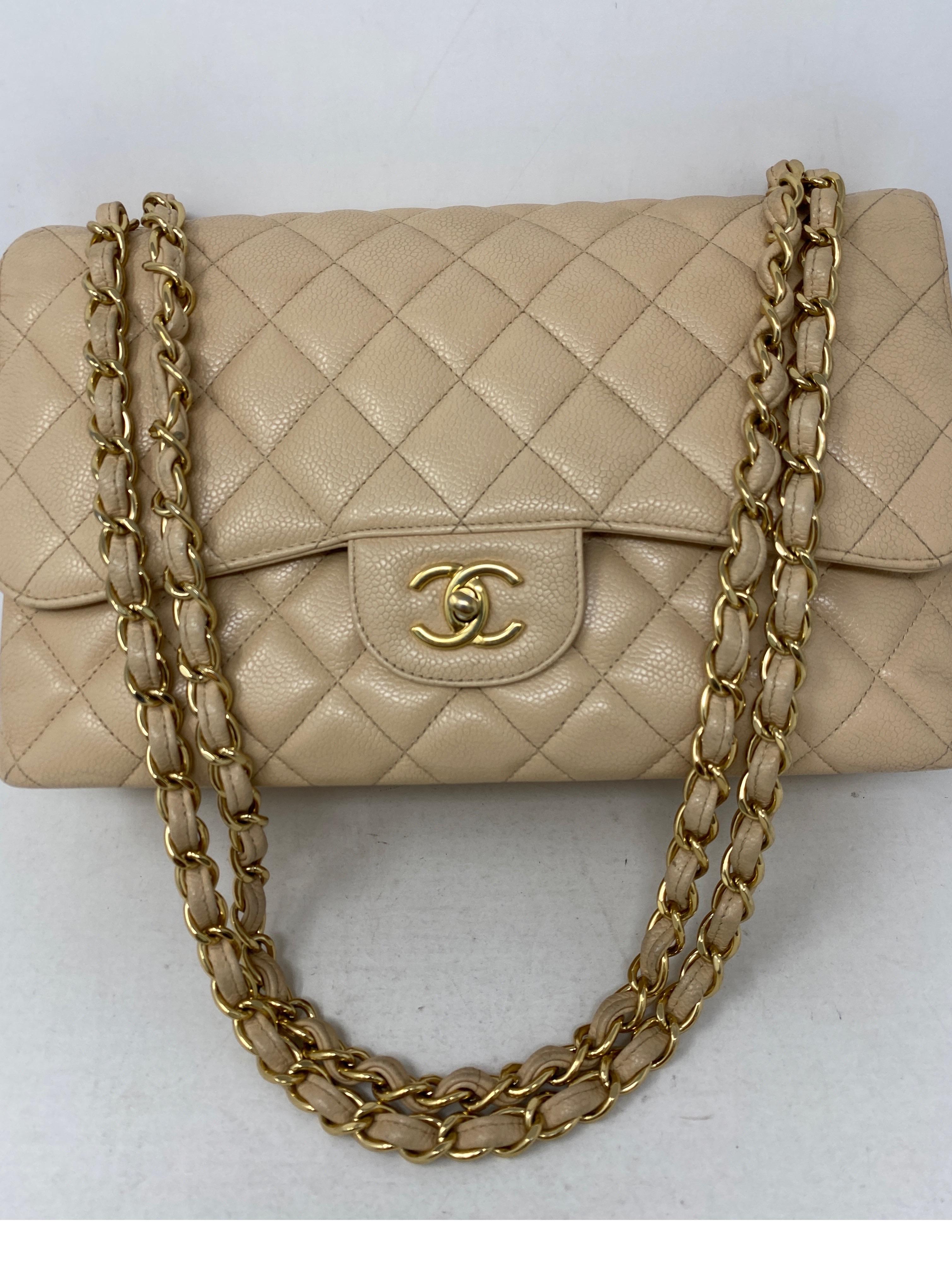 Chanel Cream Jumbo Double Flap Bag. Gold hardware. Good condition. Has light wear throughout. Caviar leather. Most wanted size jumbo. Double flap classic. Clean interior. Can be worn as a crossbody or doubled as a shoulder bag. Guaranteed authentic. 